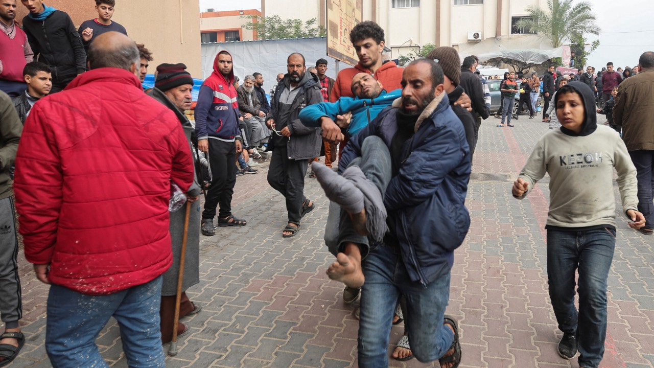 A wounded Palestinian man is rushed to Nasser hospital following Israeli strikes in Khan Younis in the southern Gaza Strip. /Ibraheem Abu Mustafa/Reuters
