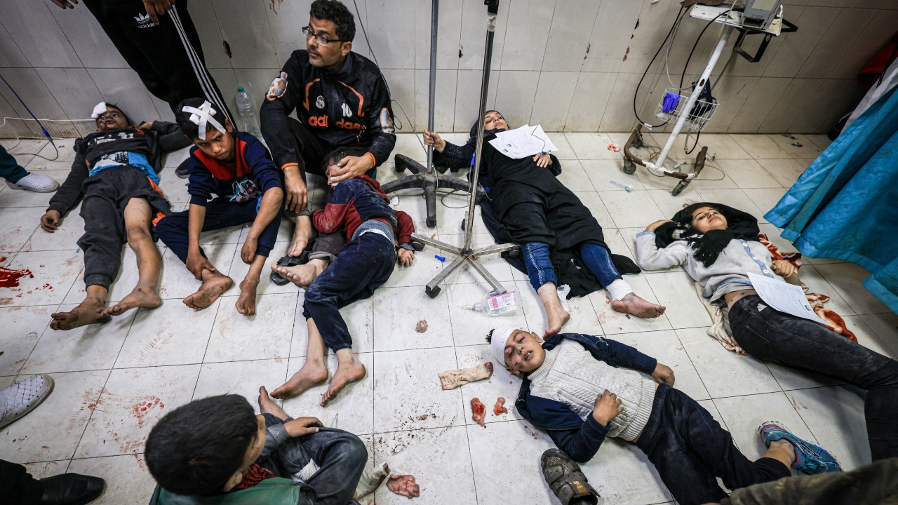 Members of the al-Qedra family, who were injured during Israeli bombardment, receive treatment at Nasser hospital in Khan Yunis in the southern Gaza Strip. /Mahmud Hams/AFP