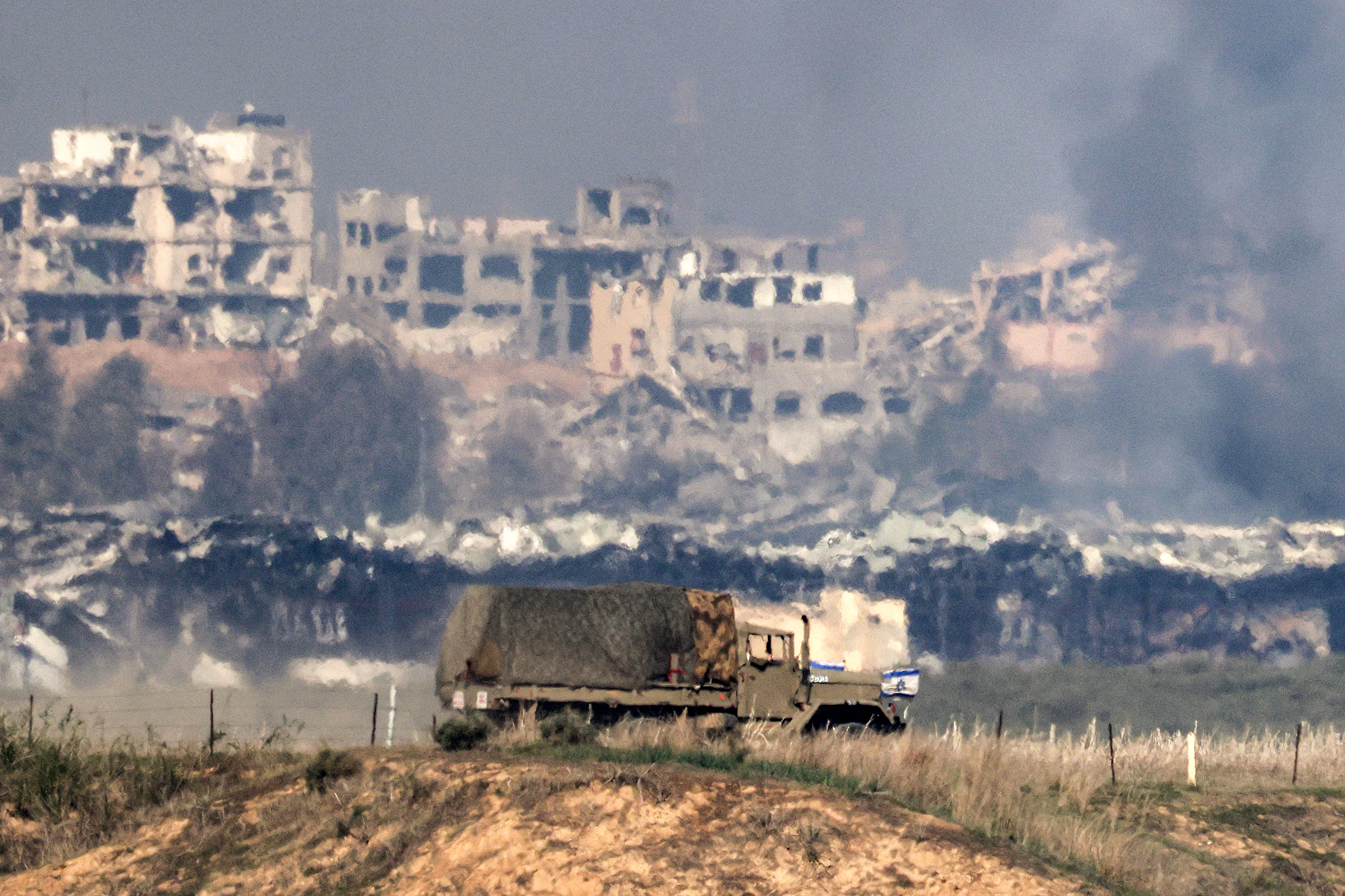 An Israeli army truck moves along the border with the northern Gaza Strip from a position in southern Israel amid the ongoing conflict between Israel and the Palestinian militant group Hamas Menahem Kahana/AFP.


