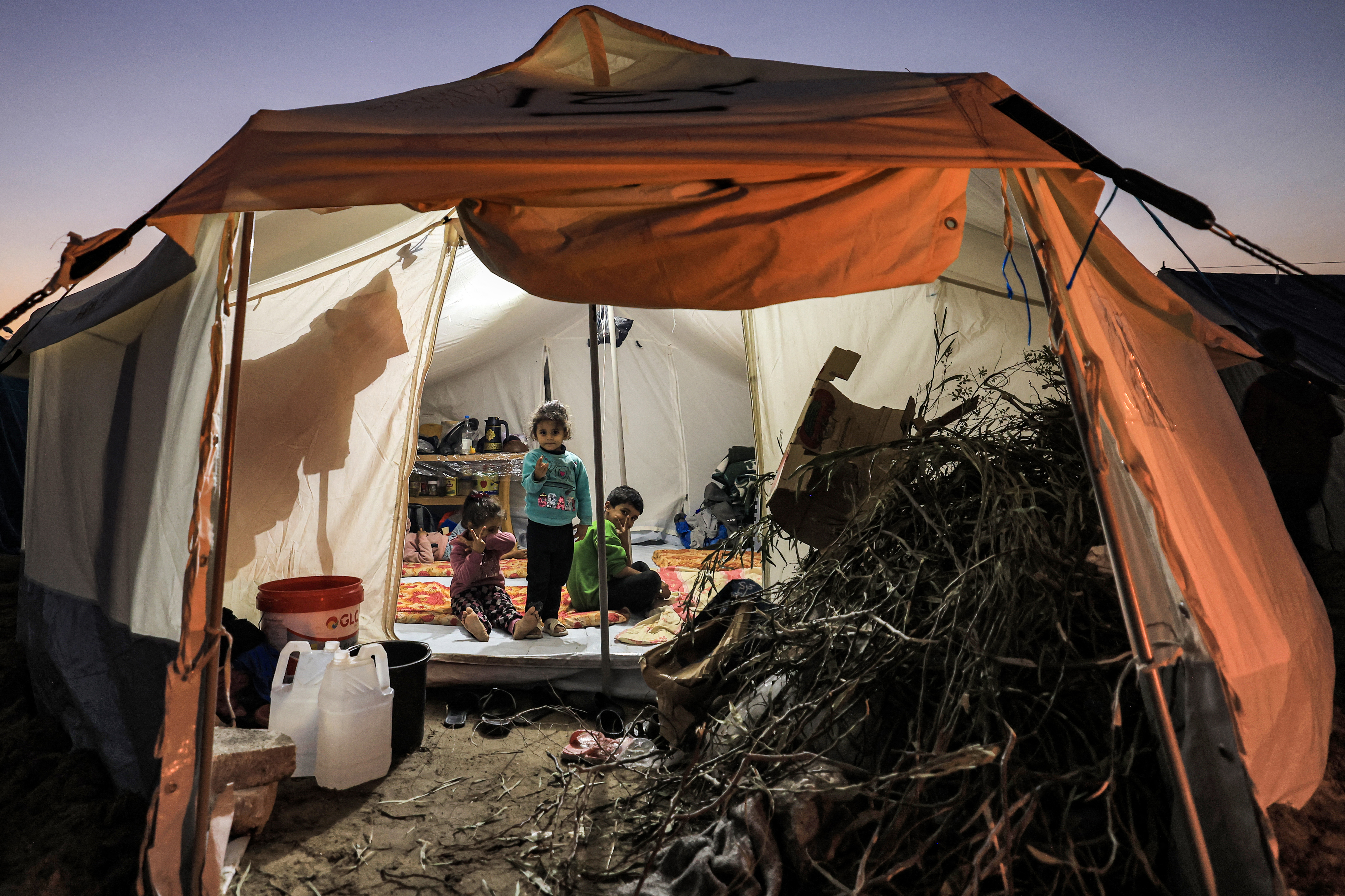 Firewood is placed at the entrance of a tent housing Palestinians displaced by the conflict in Gaza between Israel and the Palestinian Hamas movement, in Rafah in the southern Gaza Strip.
Mahmud Hams/AFP.