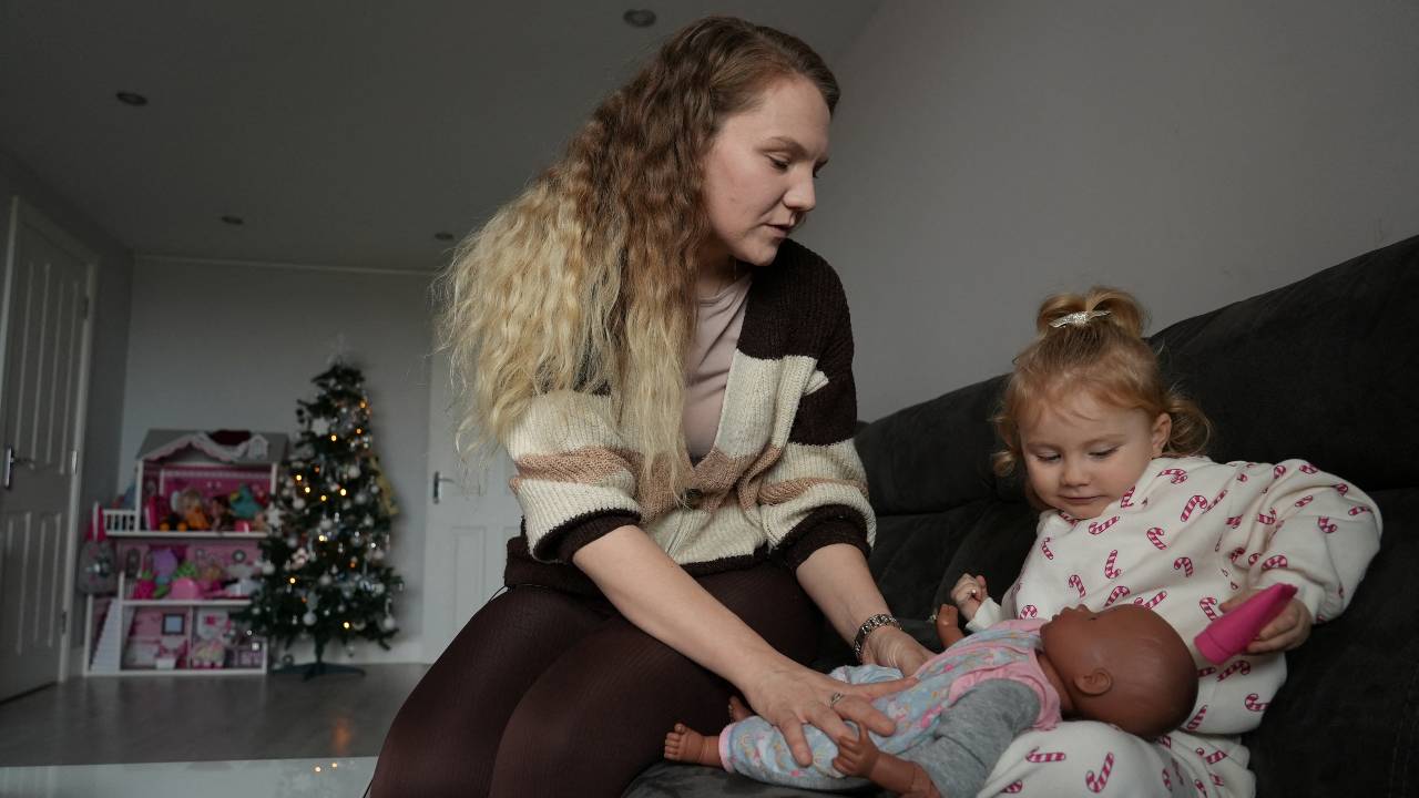 Paige Ballmi, 29, and her husband Tom, 29 who is from Albania, fear the new rules will split them up. /Natalie Thomas/Reuters