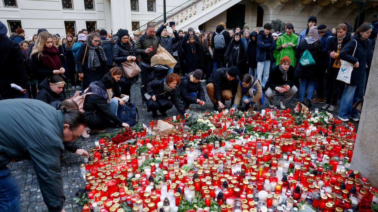 People lay tributes at a memorial during a vigil following a shooting at one of Charles University's buildings in Prague. /David W Cerny/Reuters<br />
