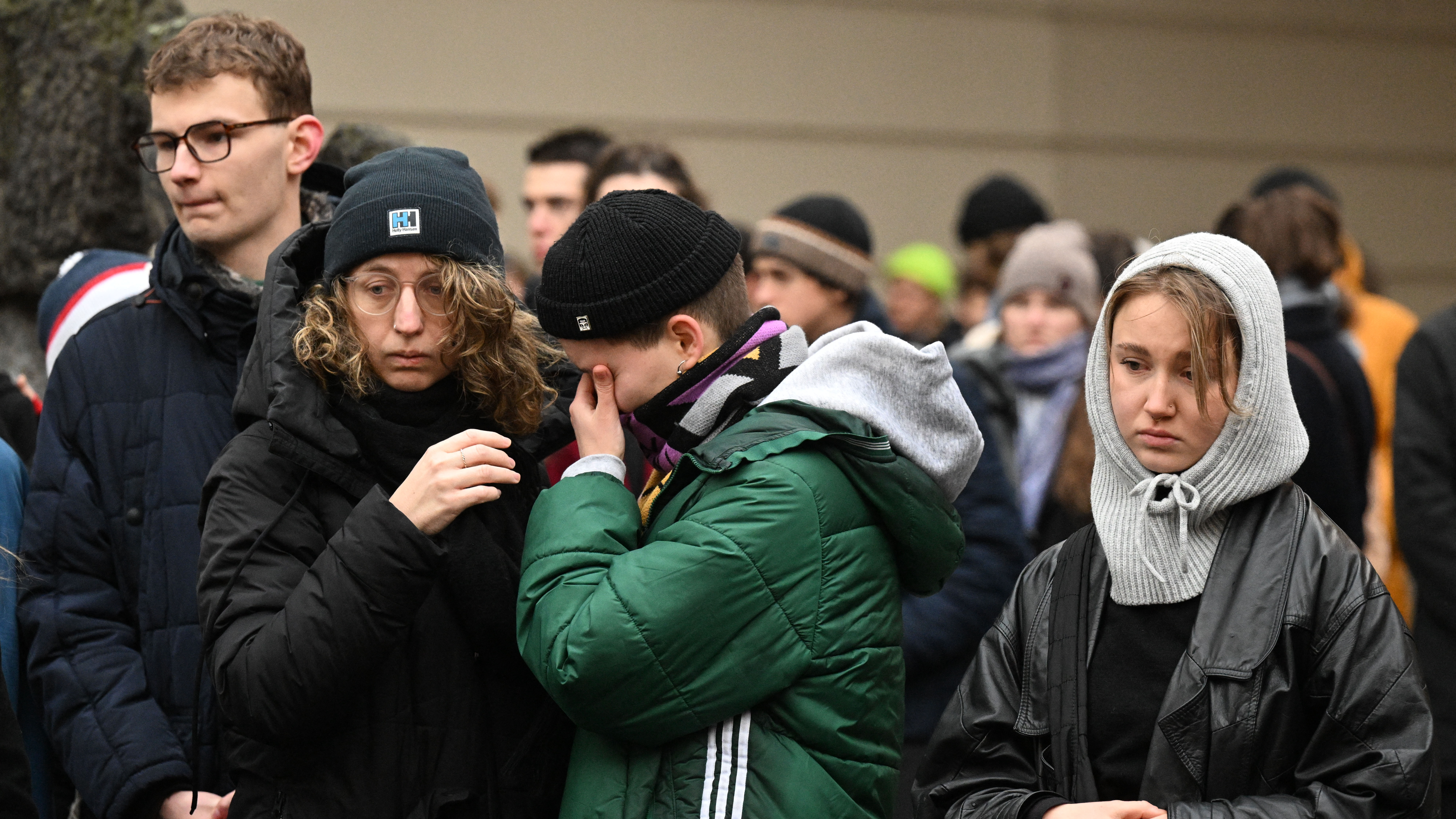 Tearful mourners in Prague following Thursday's mass shooting in the city. /Michal Cizek/AFP
