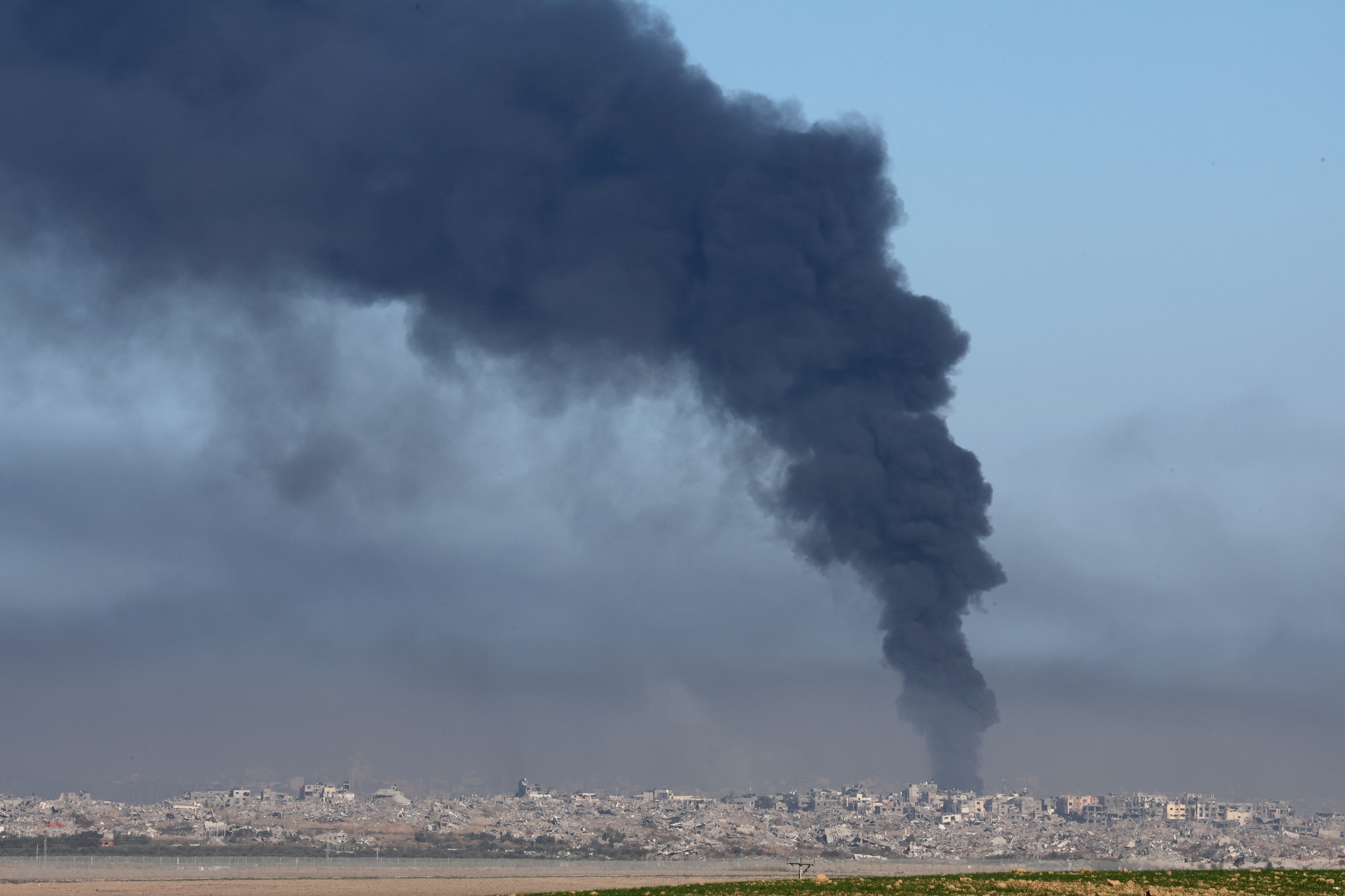 Plumes of smoke billow over southern Gaza, as Israel continues its bombardment of the region and resists international calls for a ceasefire. /AFP.