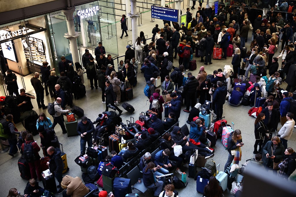 Passengers at London's St Pancras station were left stranded as they waited to find out whether their journeys would go ahead as planned. /Henry Nicholls/AFP