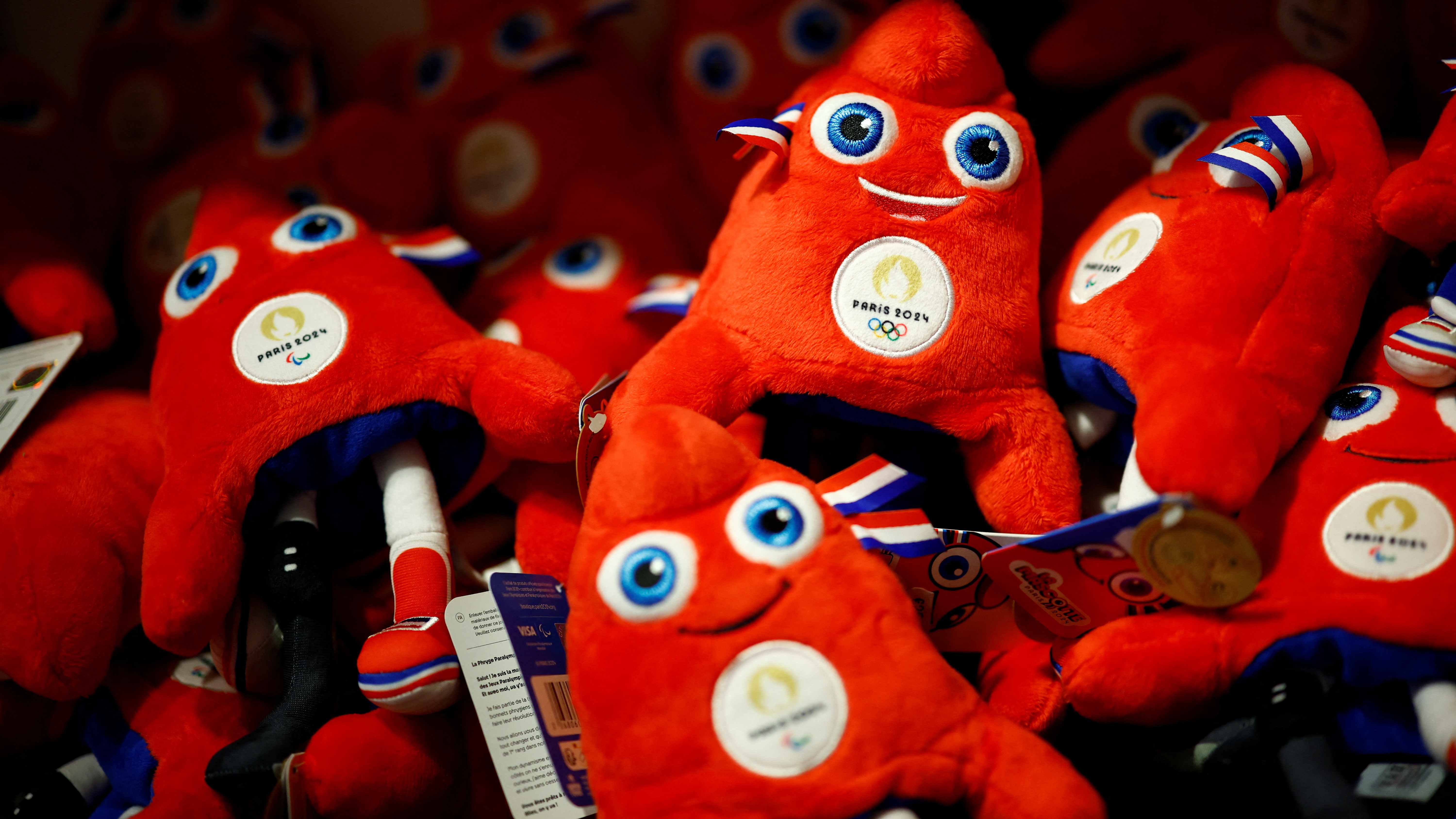 Official toy mascots, called the Phryges, of the Games on sale at Carrousel du Louvre. /Sarah Meyssonnier/Reuters