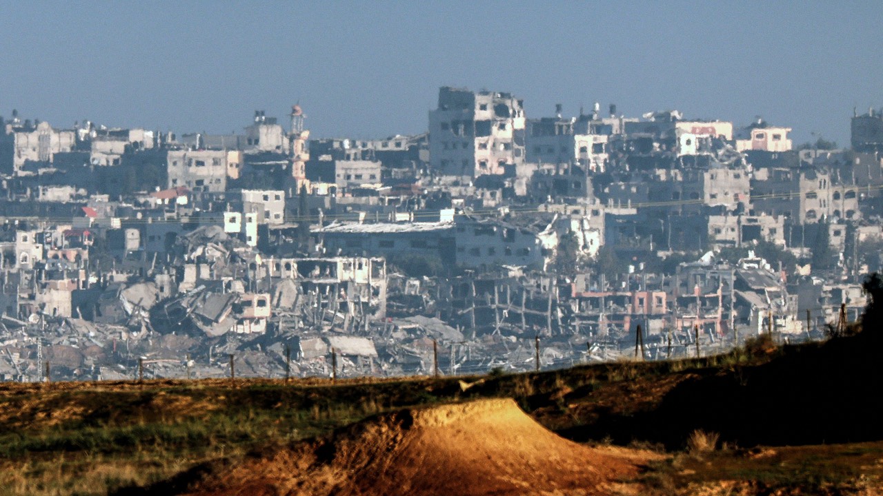 Buildings destroyed by Israeli bombardment in the central Gaza Strip, from a position across the border in southern Israel. /Jack Guez/AFP