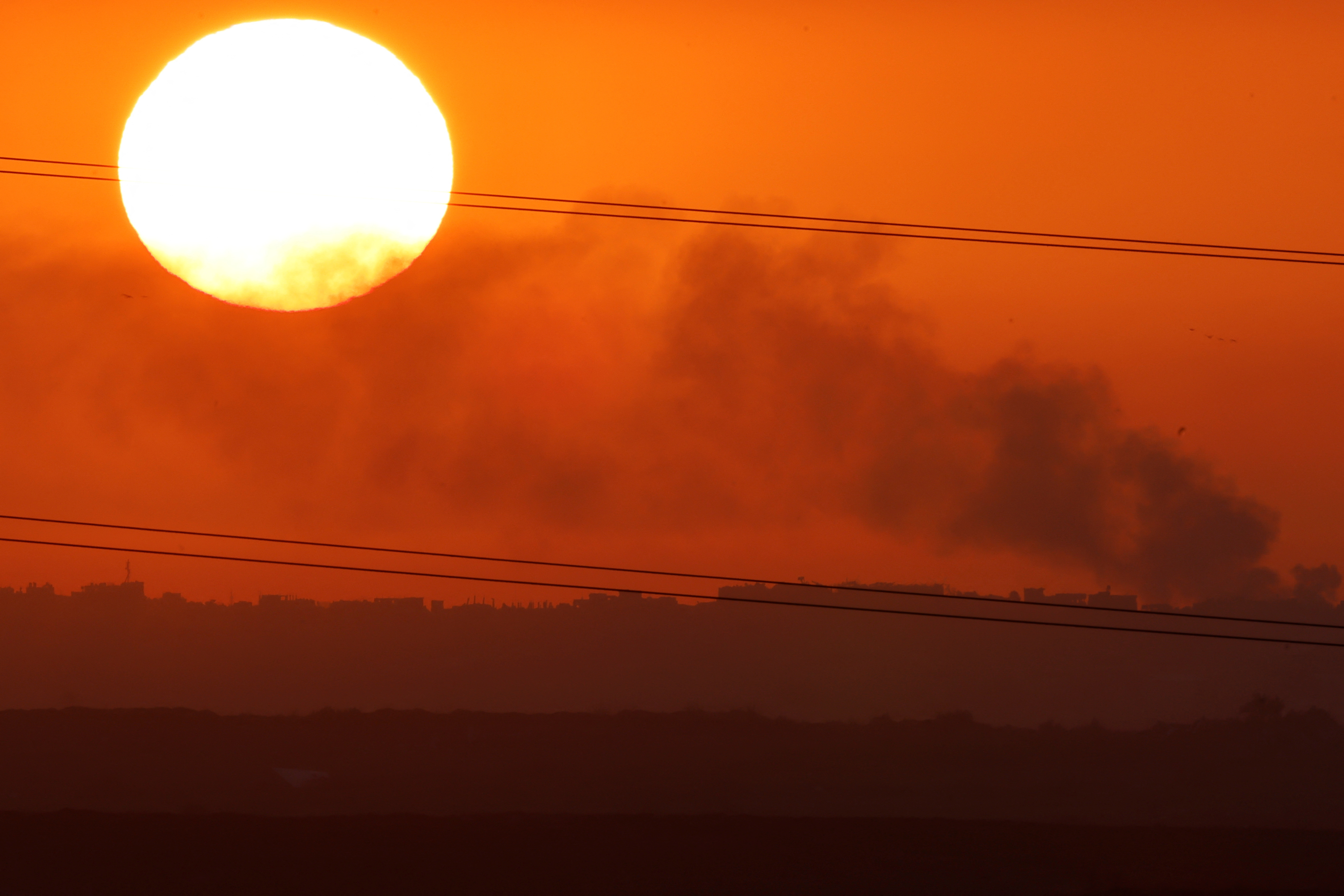 As the sun sets over Gaza, there is still no end in sight for this bloody conflict. /Tyrone Siu/Reuters