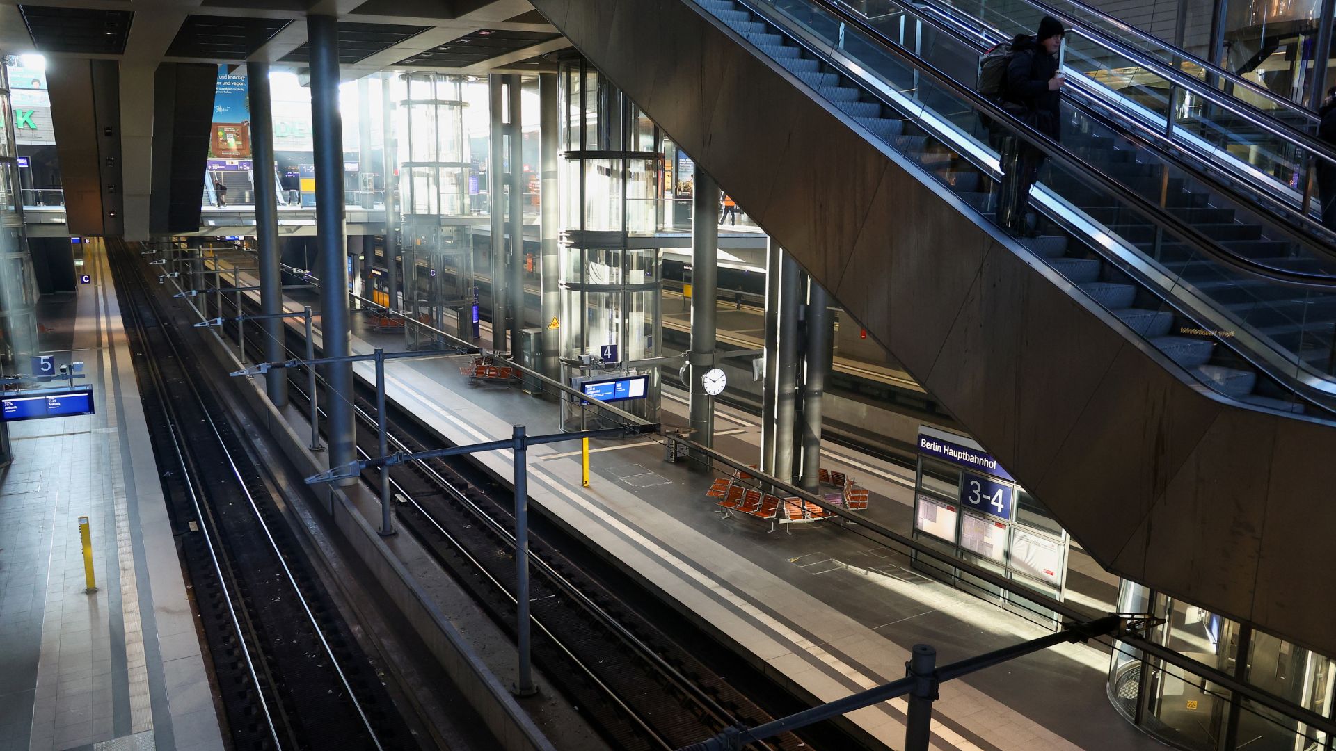 A passenger rides an escalator at Berlin's near-empty Hauptbahnhof train station. /Fabrizio Bensch/Reuters