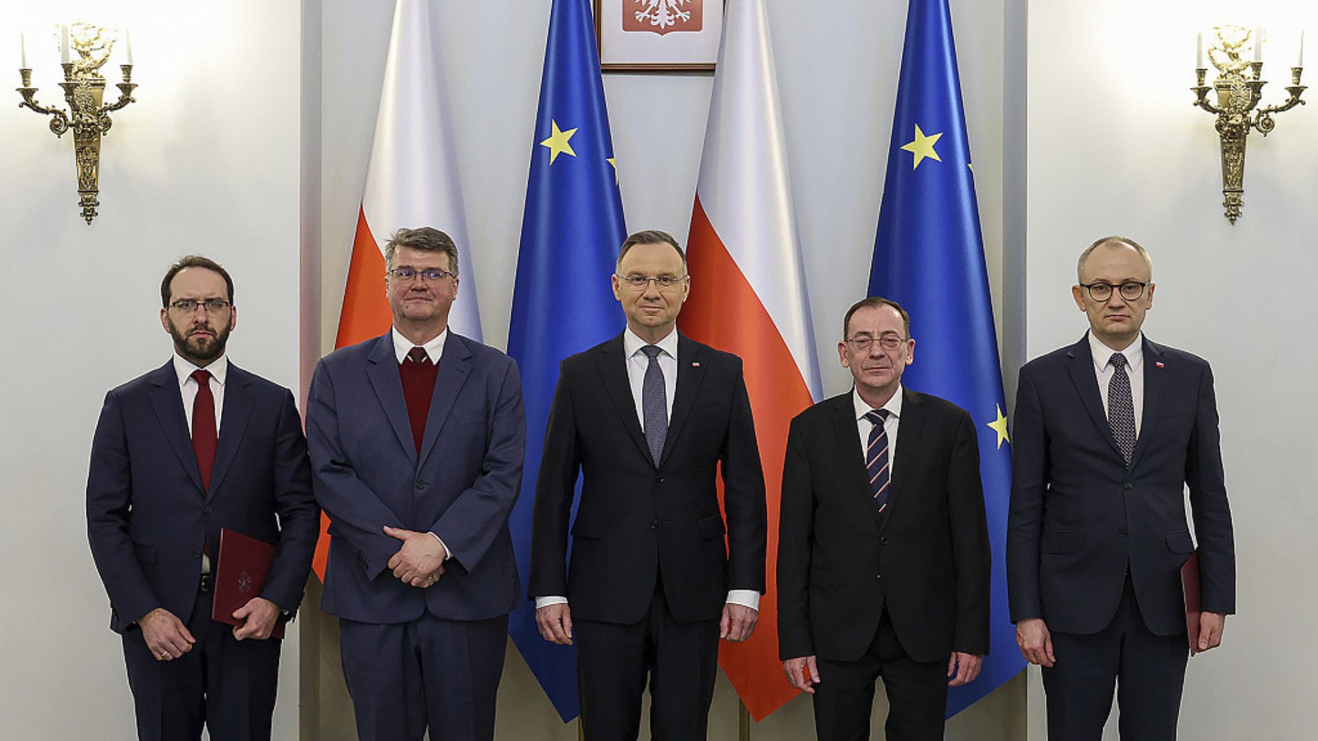 Poland's President Andrzej Duda, center, is flanked by Maciej Wasik (center left) and Mariusz Kaminski (center right). /Jakub Szymczuk/President Palace