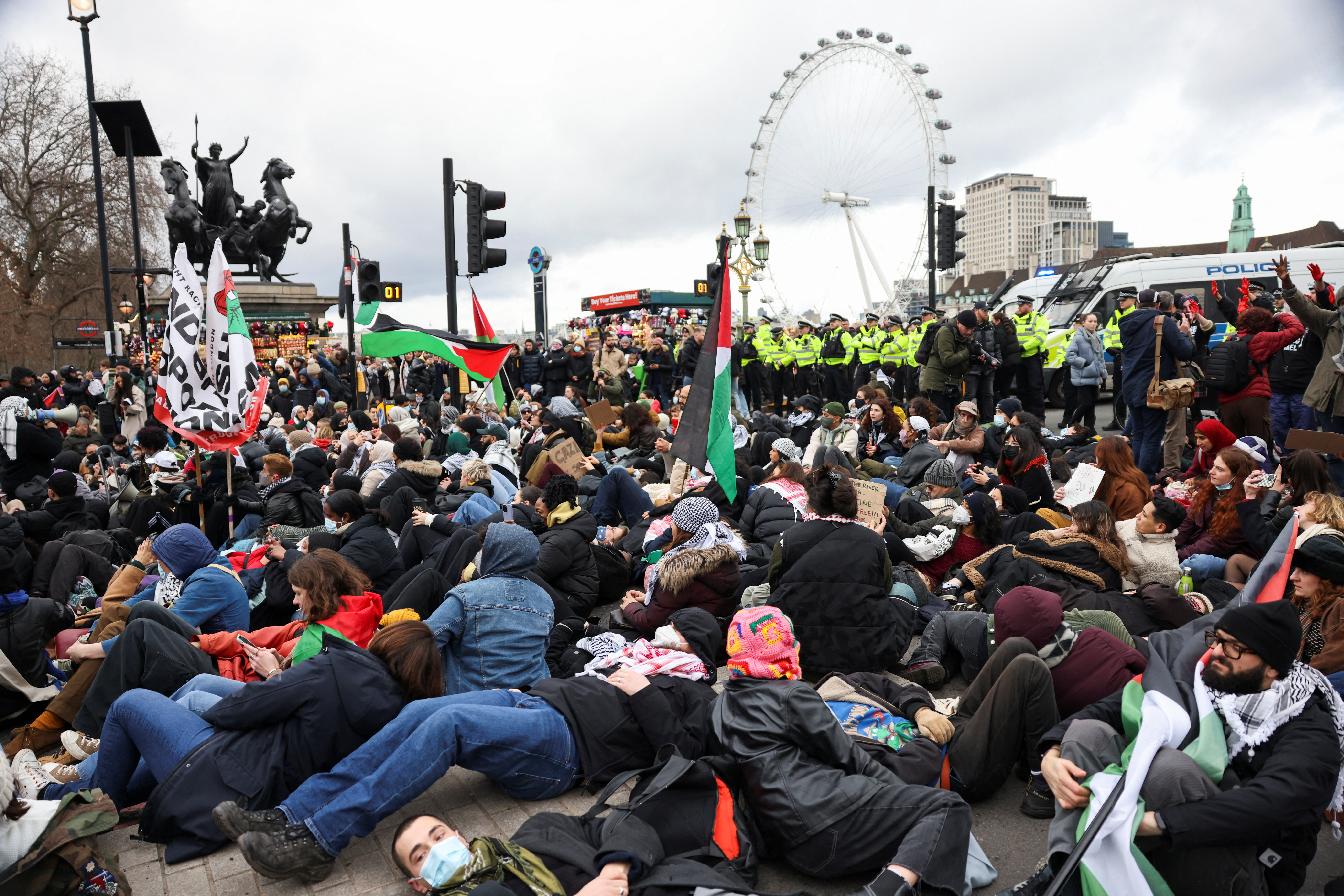 People take part in a protest in solidarity with Palestinians in Gaza held in London. Hollie Adams/ Reuters