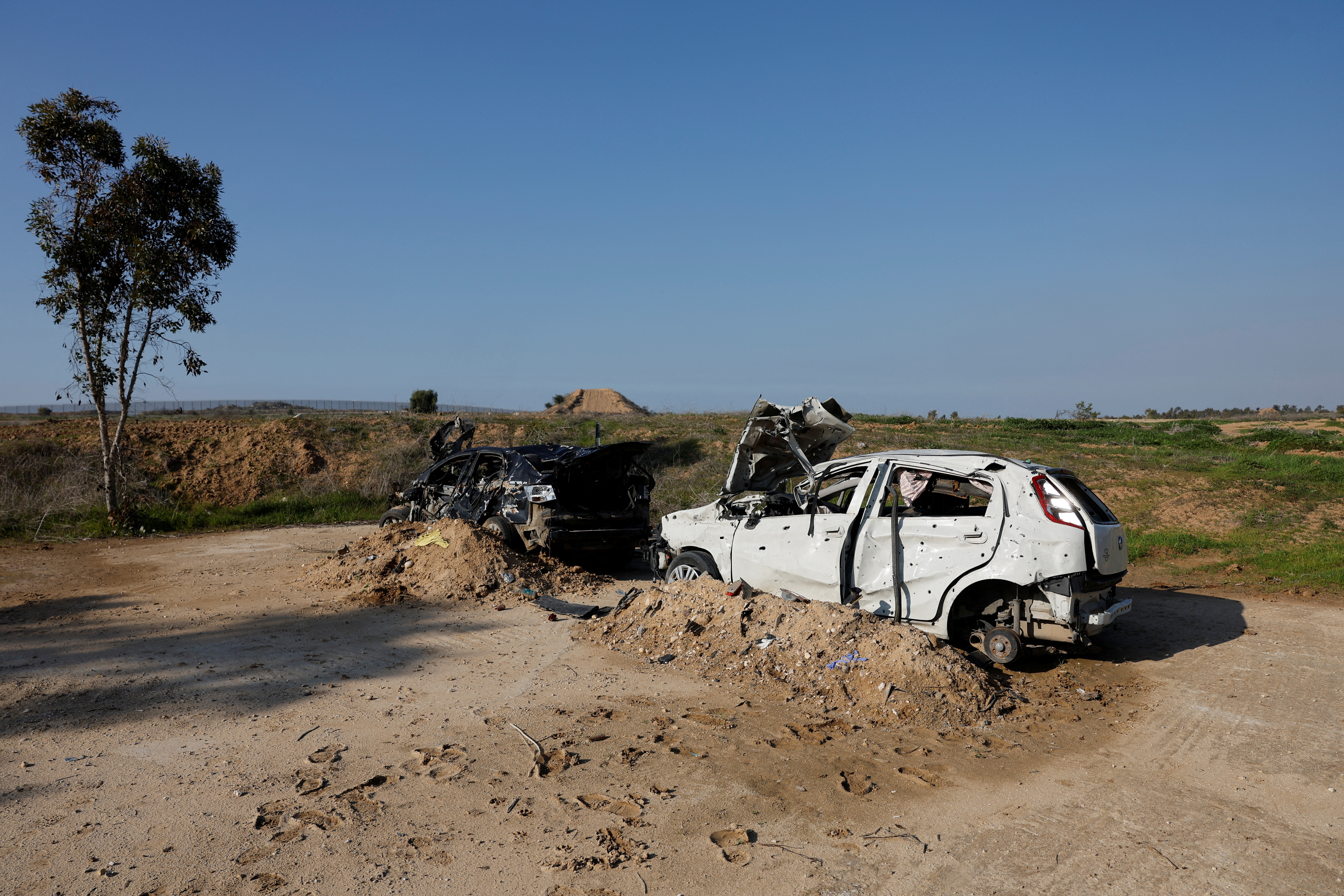 Damaged, burnt out vehicles are seen parked near the Israel-Gaza border./Reuters/Amir Cohen.
