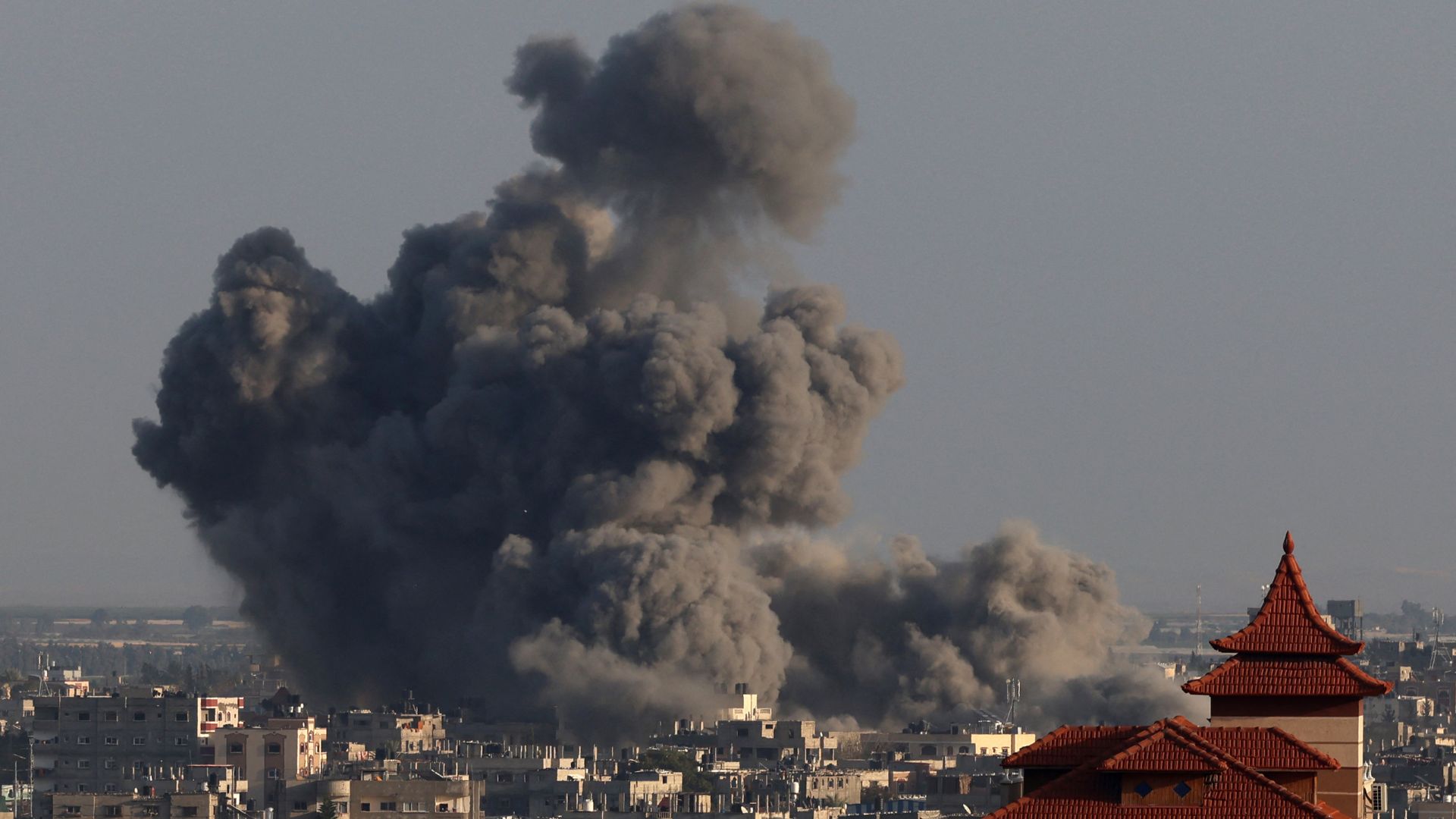 Smoke billowing over Khan Yunis in the southern Gaza Strip during Israeli bombardment. /AFP
