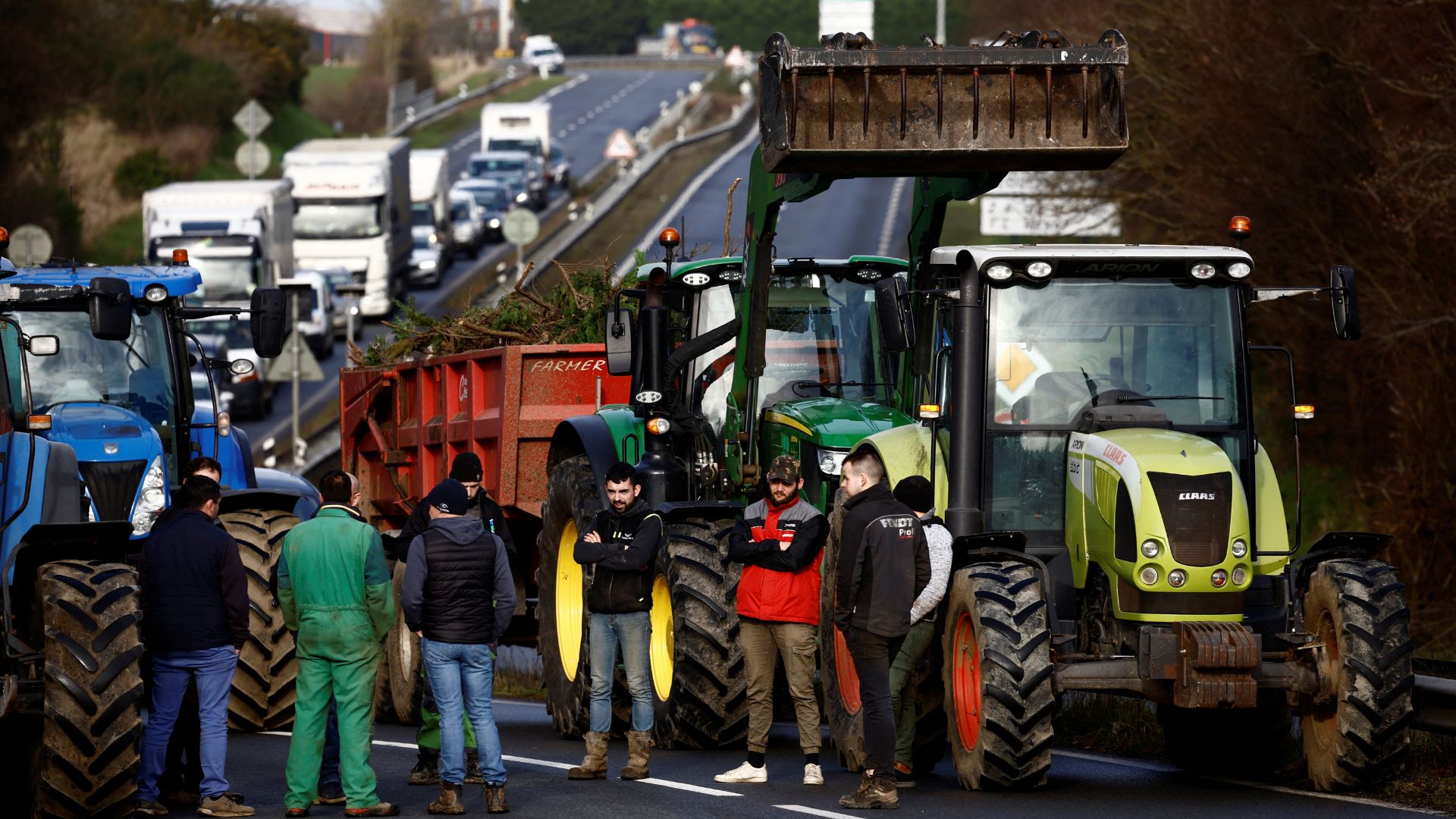 French farmers block the N12 road with their tractors in Plouisy near Guingamp, Brittany, France, January 24, 2024. /Stephane Mahe/Reuters