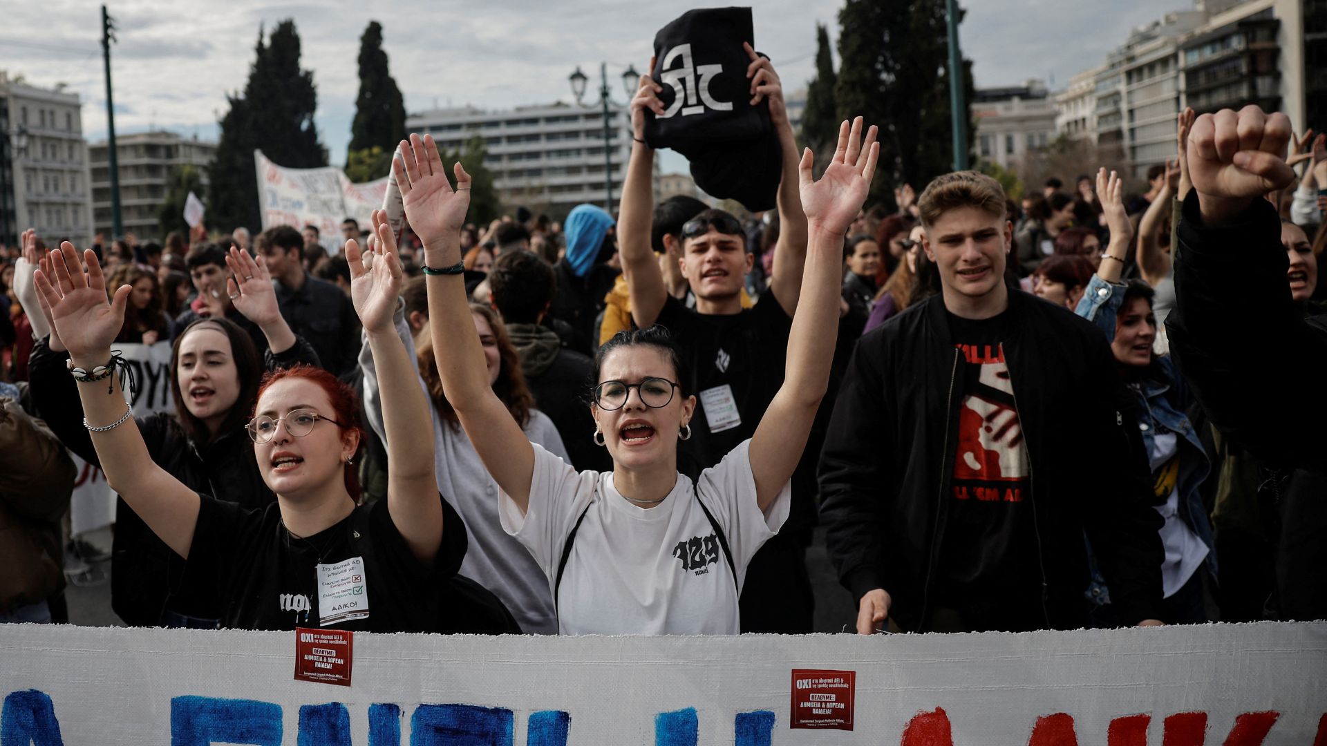 Greek university and high school students chant slogans in front of the Greek parliament. /Louisa Gouliamaki/Reuters