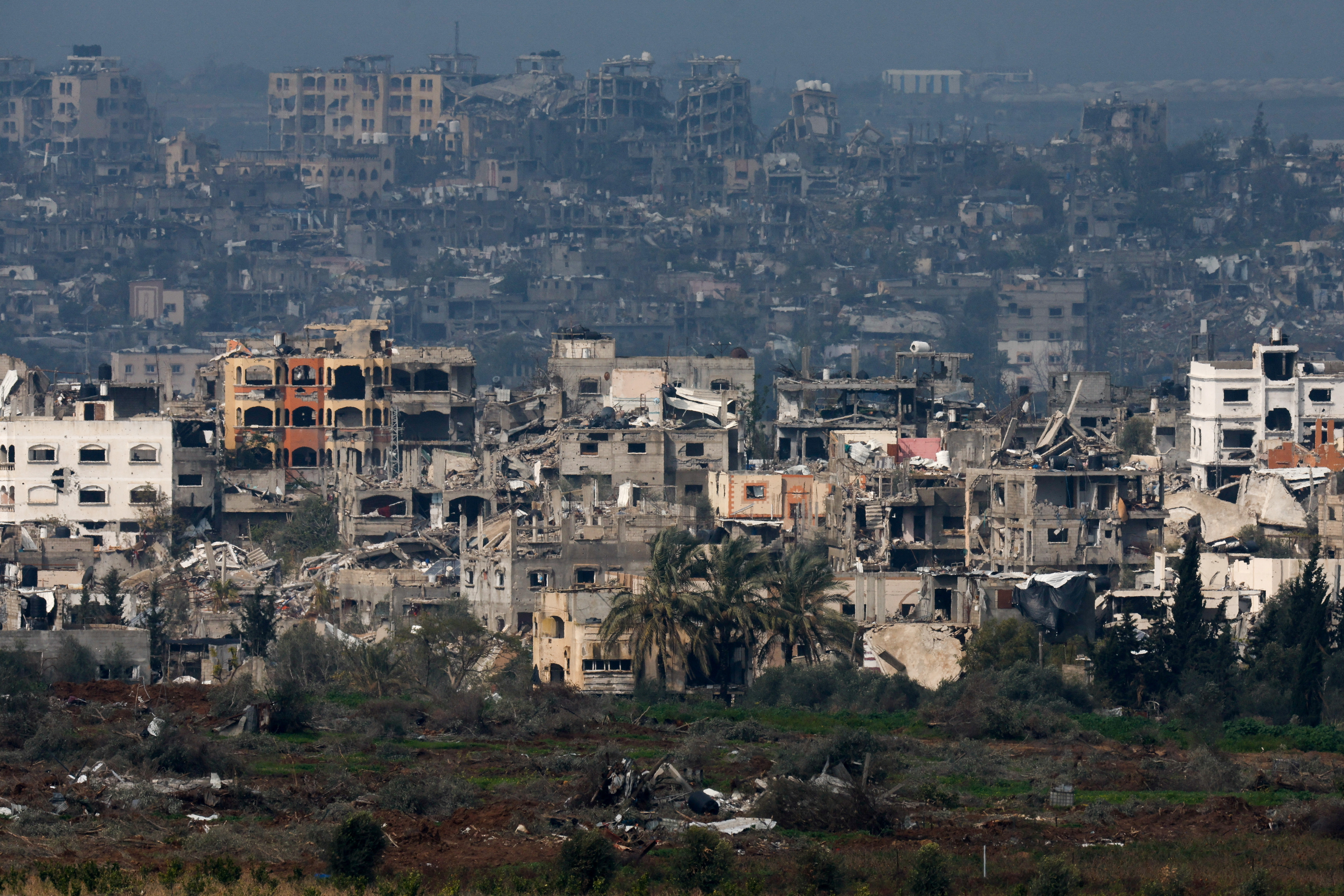Damaged houses lie in ruin in Gaza, amid the ongoing conflict between Israel and the Palestinian Islamist group Hamas, as seen from Israel./Amir Cohen/Reuters