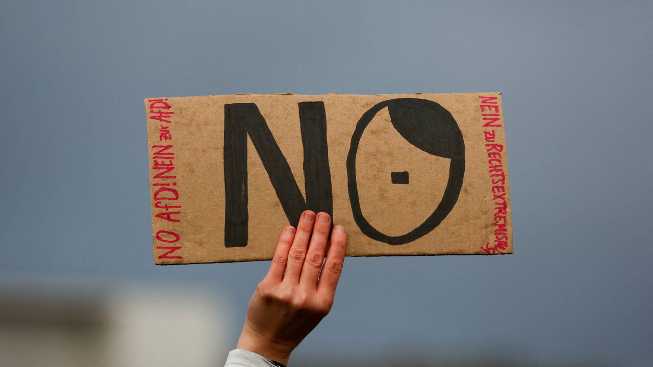 A person holds a placard at a protest against right-wing extremism in Berlin. /Fabrizio Bensch/Reuters