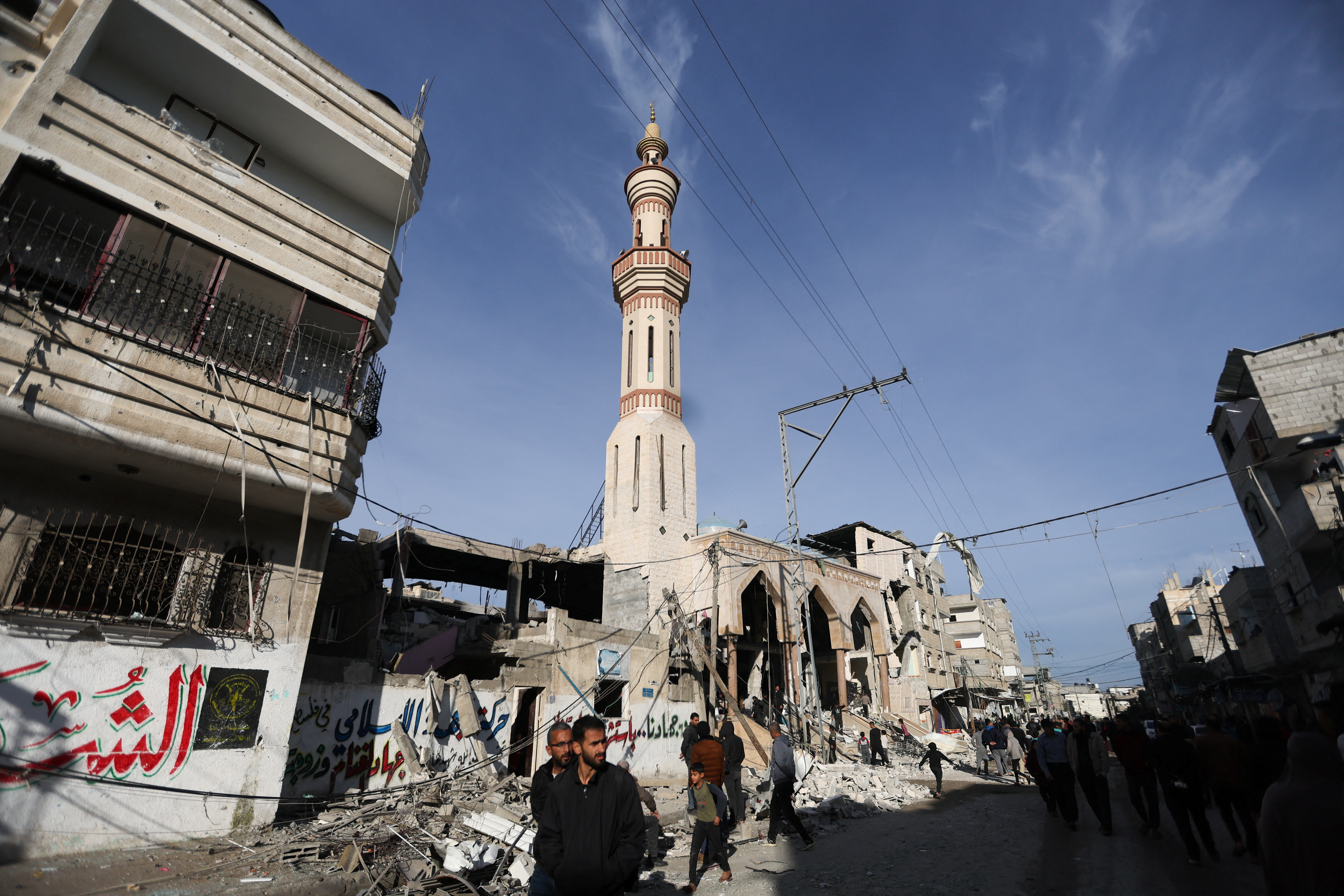 Palestinians gather at the site of an Israeli strike on a mosque. /Ibraheem Abu Mustafa/Reuters