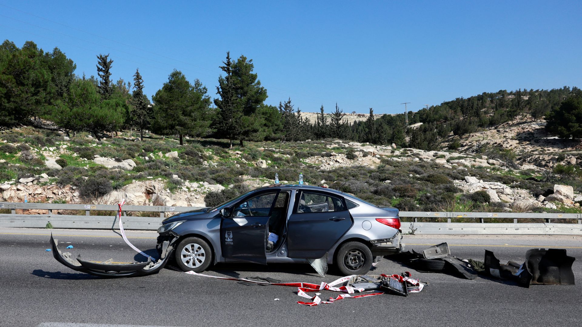 A damaged car is seen at the scene of a shooting attack by Palestinian gunmen near the Maale Adumim settlement, in the Israeli-occupied West Bank. /Ammar Awad/Reuters