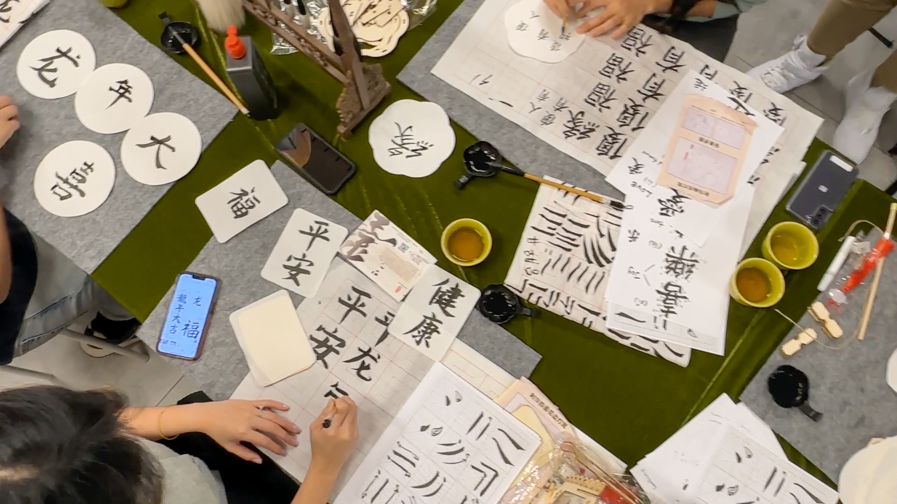 Chinese calligraphy practised before before being applied to lanterns /CGTN