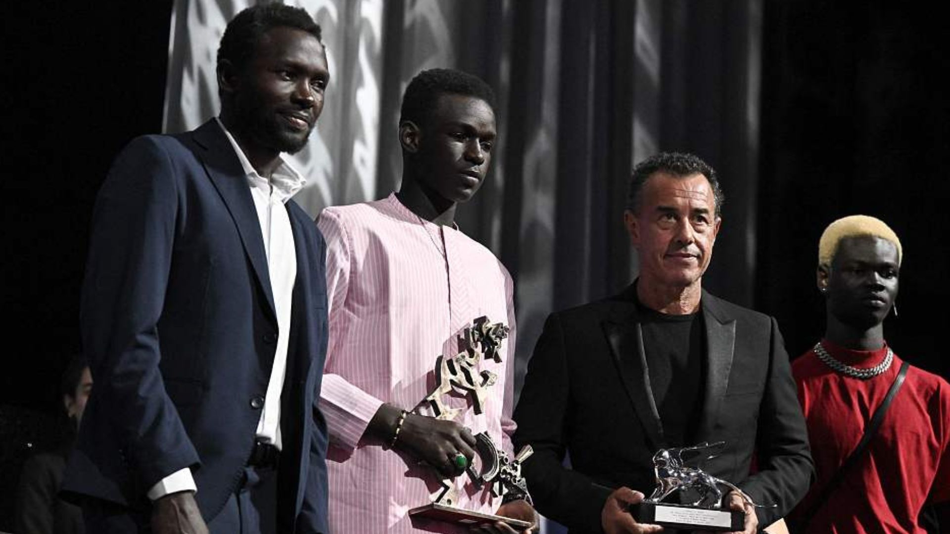 Mamadou Kouassi with actor Seydou Sarr, director Matteo Garrone and actor Moustapha Fall at the 2023 Venice International Film Festival. /CFP