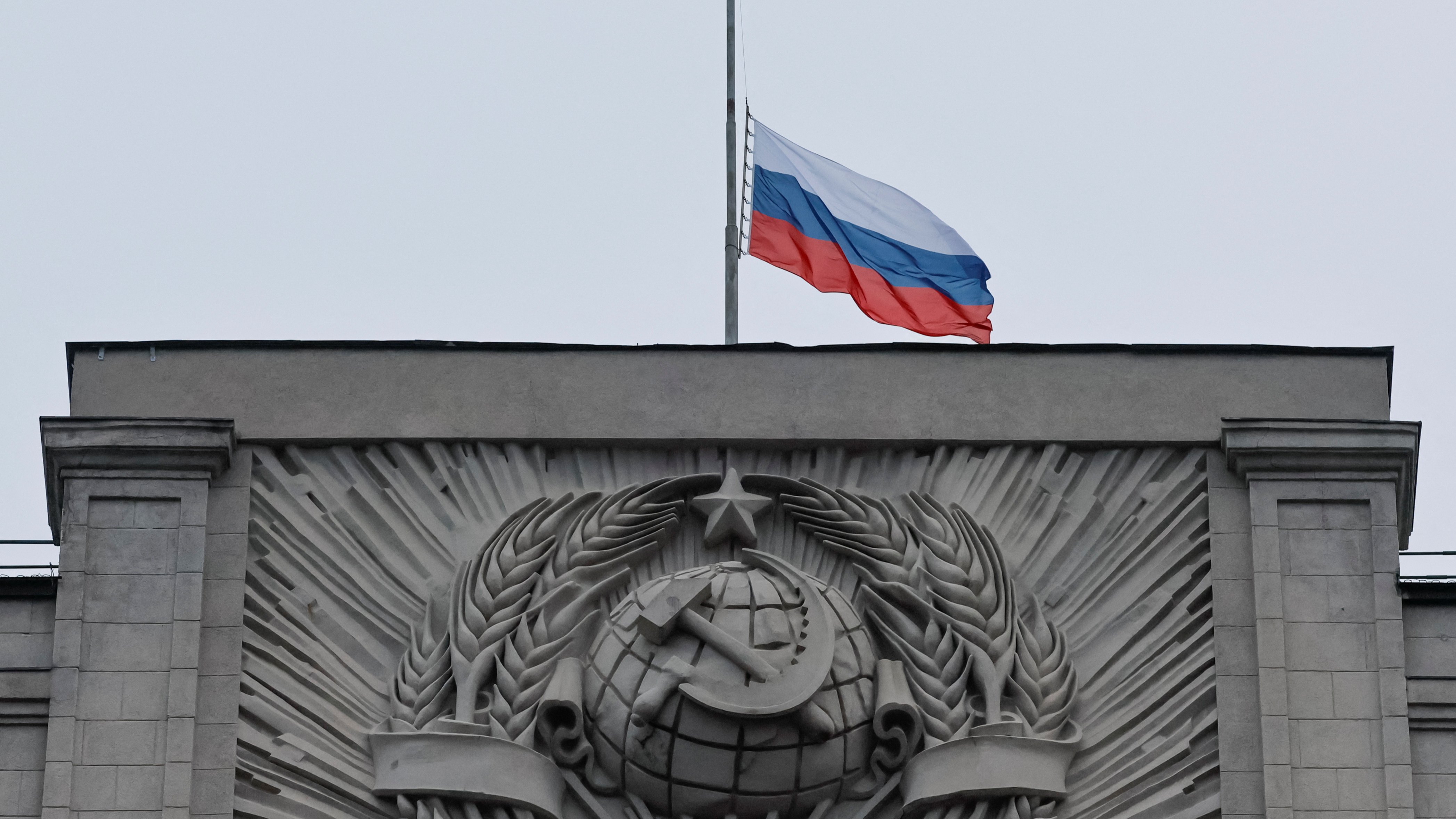 A Russian national flag is seen lowered on the headquarters of State Duma, the lower house of parliament, on Sunday's day of mourning. /Shamil Zhumatov/Reuters