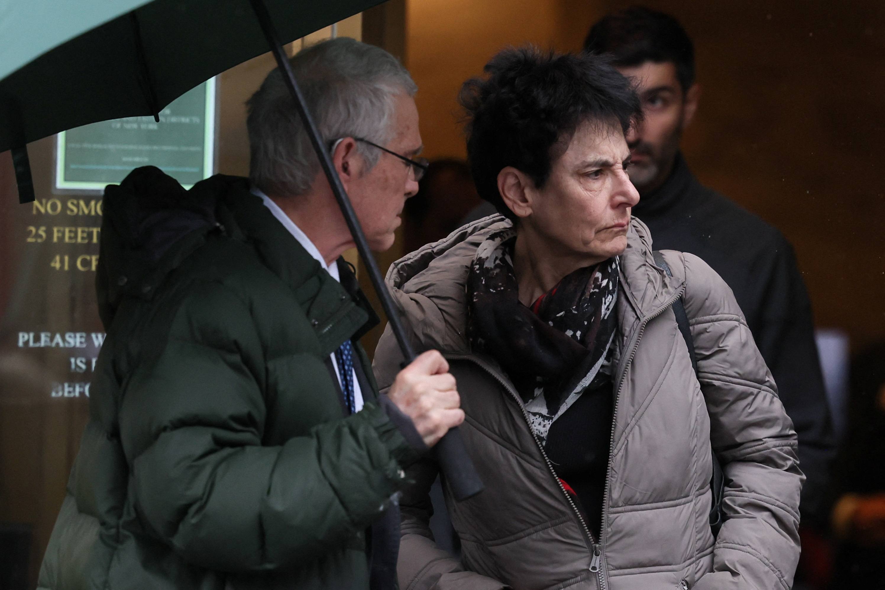 Bankman-Fried's parents Joseph and Barbara stand outside the Federal Court after his sentencing. /Brendan McDermid/Reuters
