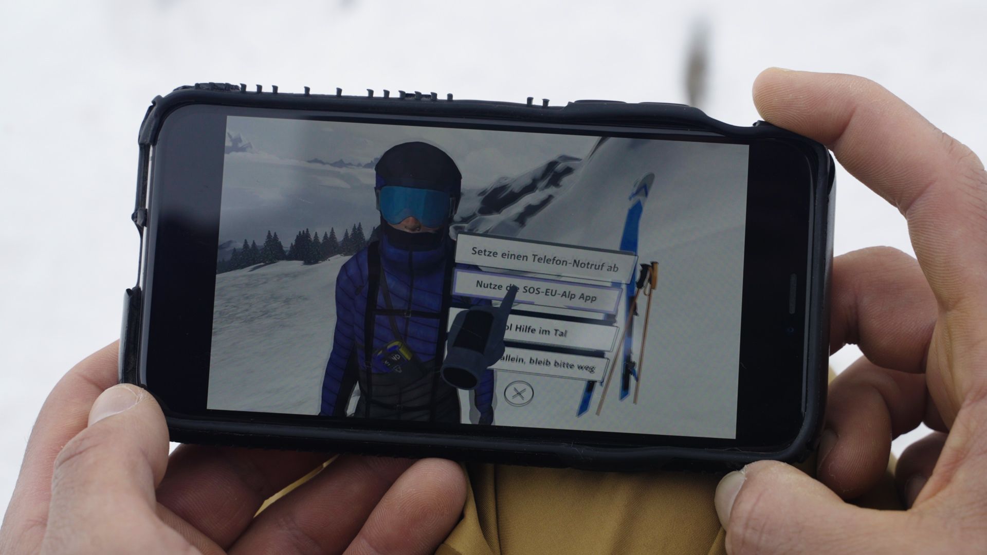 A skier uses a virtual simulator app showing how to respond to an avalanche. /Gasser/CGTN
