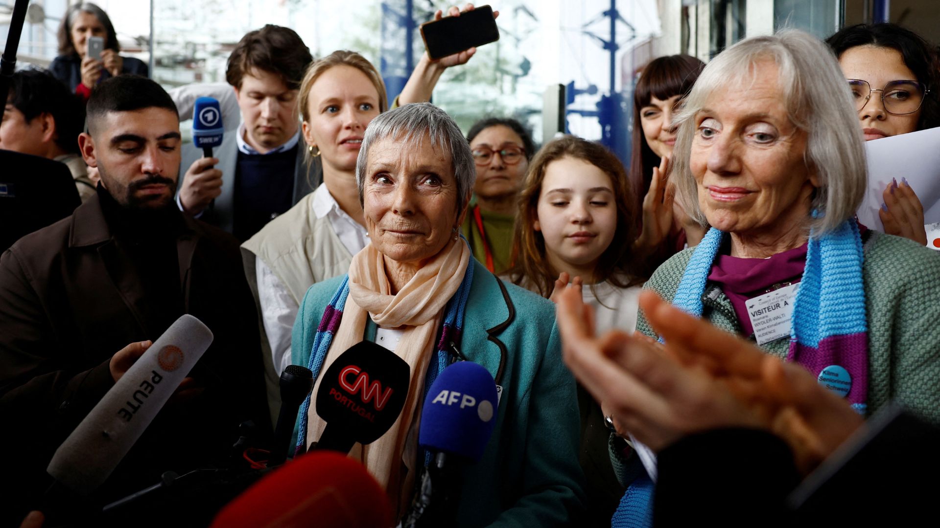 Anne Mahrer and Rosmarie Wydler-Walti of the KlimaSeniorinnen group talk to journalists outside the court. /Christian Hartmann/Reuters
