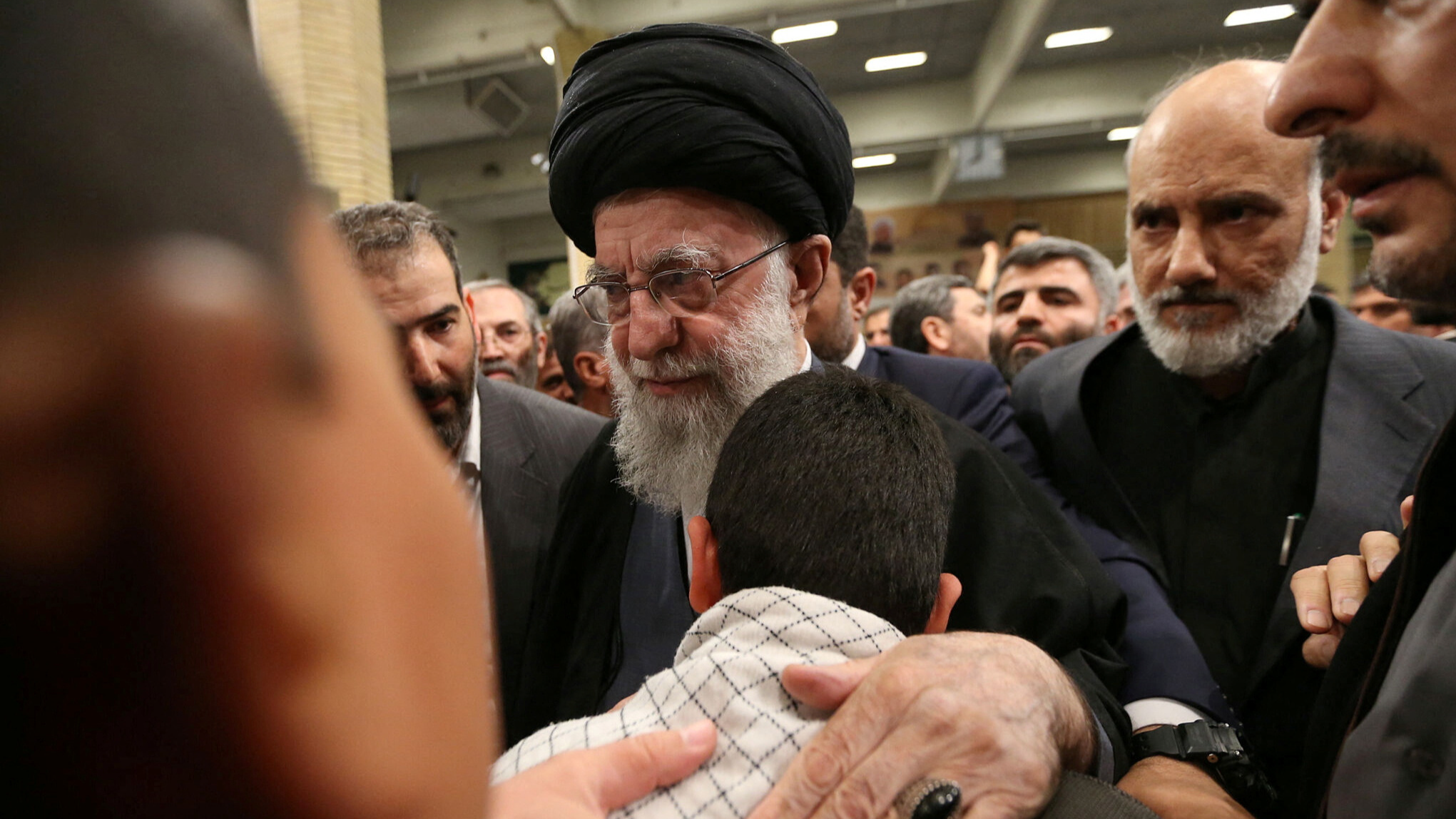 Iran's Supreme Leader, Ayatollah Ali Khamenei, meets with the family of one of the members of the Islamic Revolutionary Guard Corps who were killed in the Israeli airstrike. /Office of the Iranian Supreme Leader/WANA/ via REUTERS