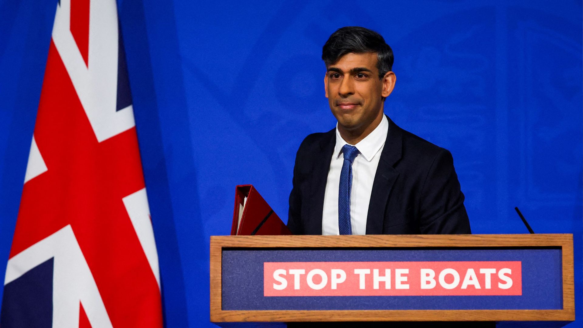UK Prime Minister Rishi Sunak reacts during a news conference on Monday. /Toby Melville/Pool/AFP

