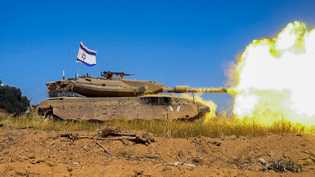 An IDF tank fires a shell near the Gaza strip. /IDF via AFP/CFP