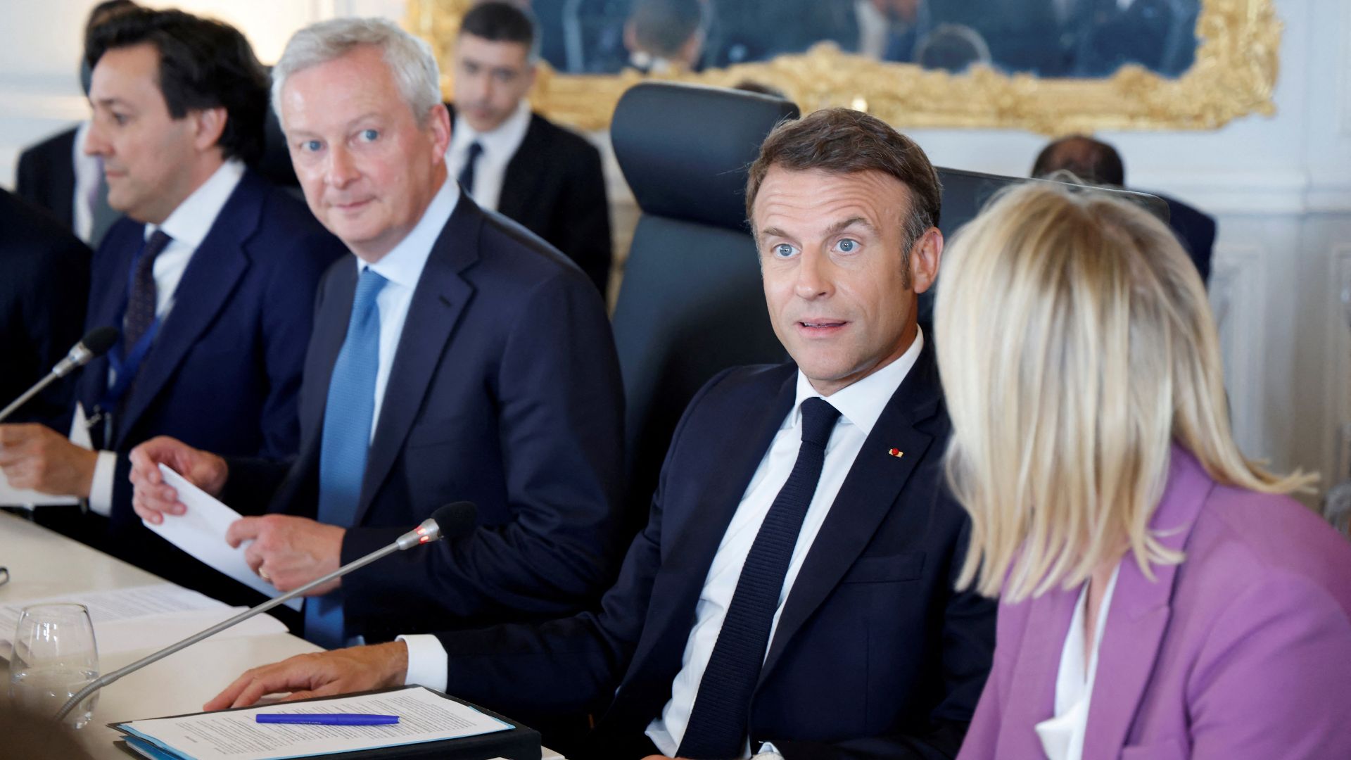 French President Emmanuel Macron (2nd right) and Economy Minister Bruno Le Maire (2nd left) at the Choose France Summit. /Ludovic Marin/Pool via Reuters