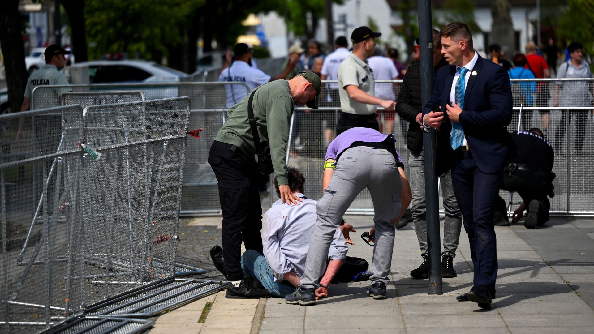 A man is detained after the shooting of Slovak PM Robert Fico. /Radovan Stoklasa/Reuters