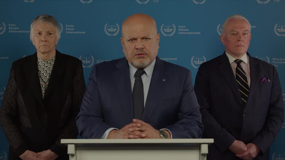 International Criminal Court prosecutor Karim Khan (center) gives a video statement. /Reuters