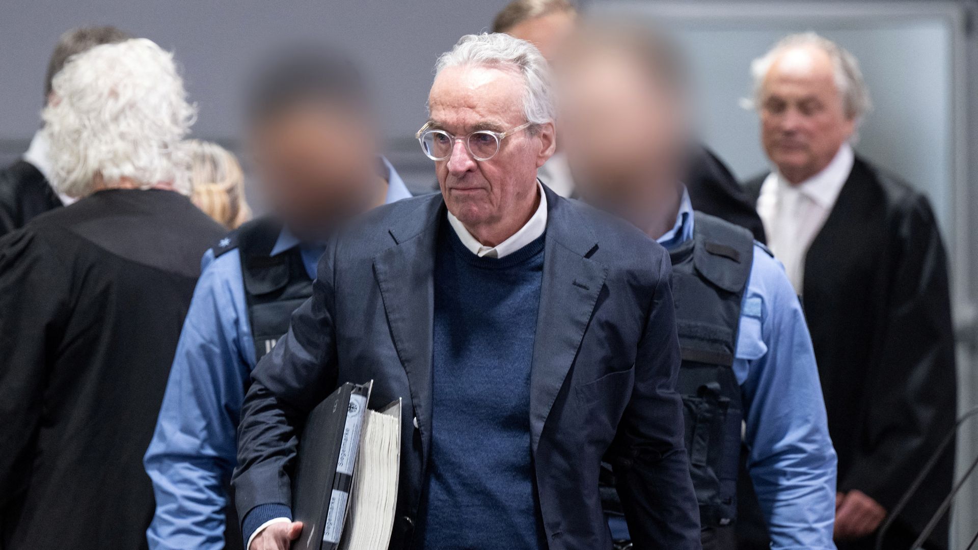 Property investor Heinrich XIII Prinz Reuss and his lawyers arrive for his trial. /Boris Roessler/Pool via Reuters
