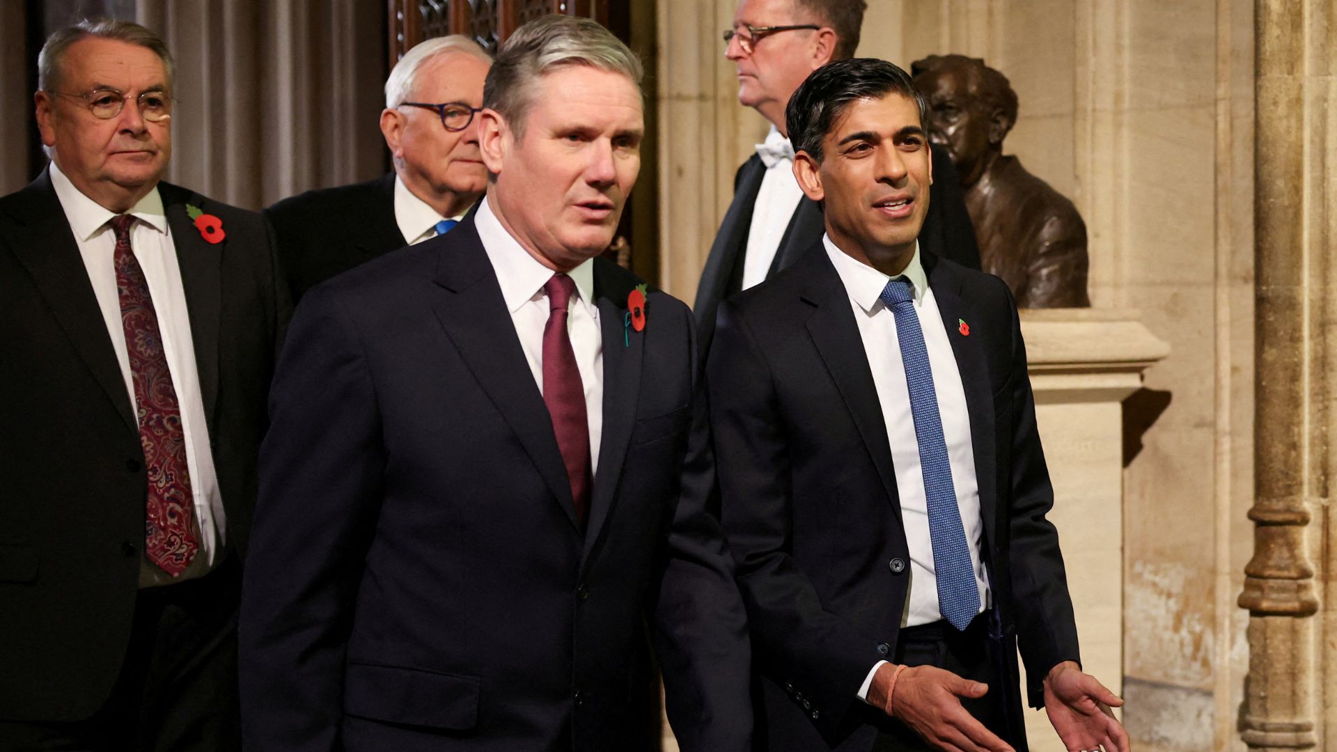 Labour Party leader Sir Keir Starmer walks with Britain's Prime Minister Rishi Sunak during the State Opening of Parliament ceremony last November. /Hannah McKay/Pool/File