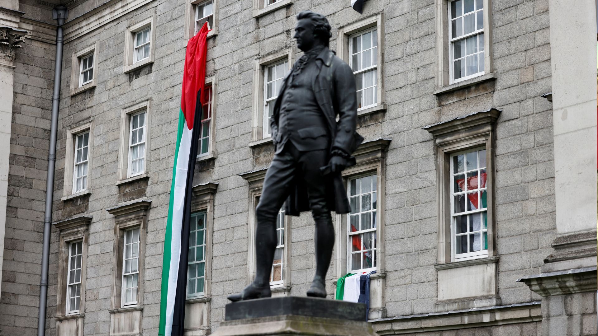 Palestinian flags hang on the front of the Trinity College in Dublin, Ireland. /Damien Eagers/Reuters
