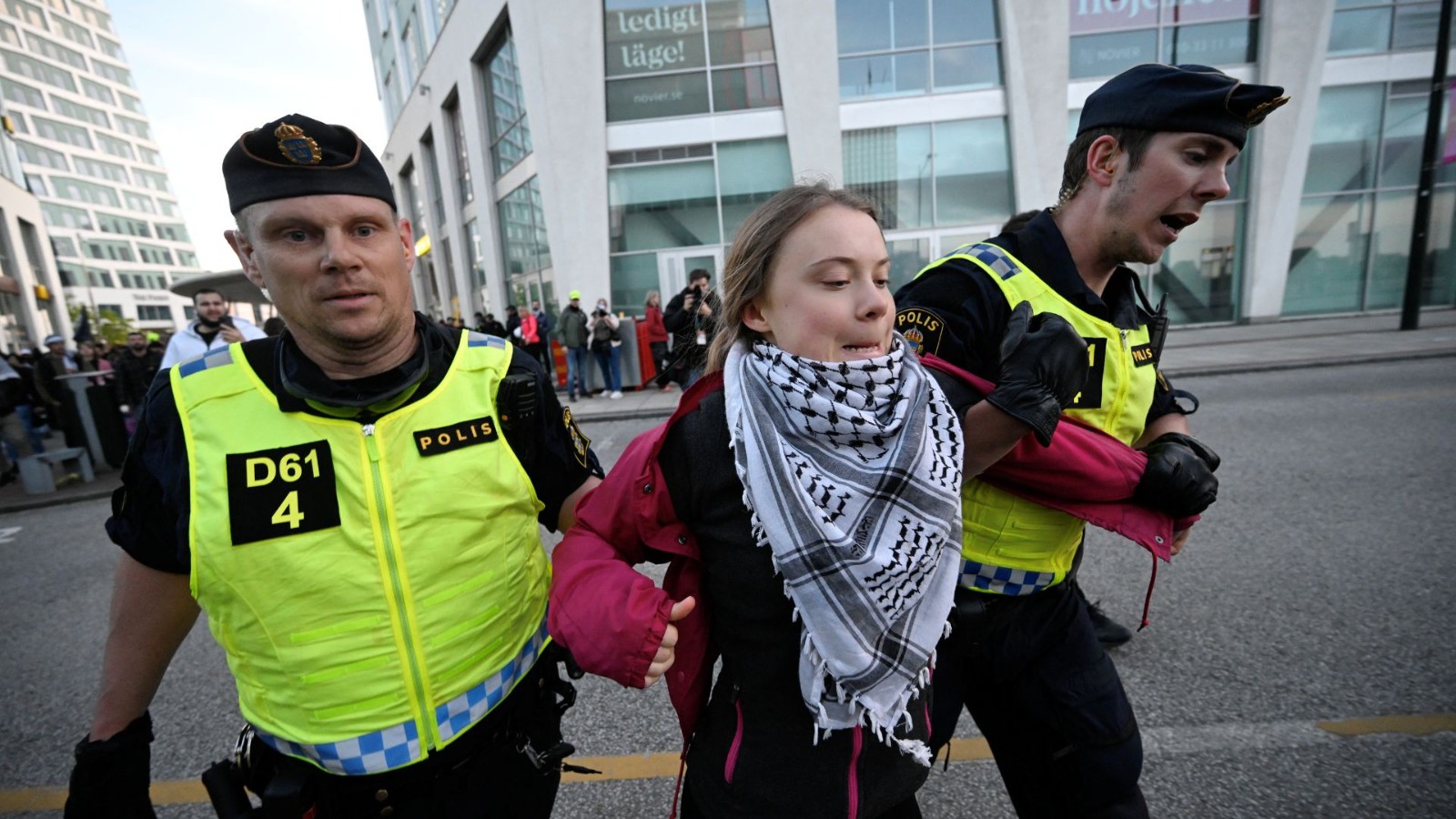 Greta Thunberg is still active - here being detained by police officers after protesting against Israel's participation in the Eurovision Song Contest in Sweden, earlier in May. /Johan Nilsson/TT News Agency via Reuters