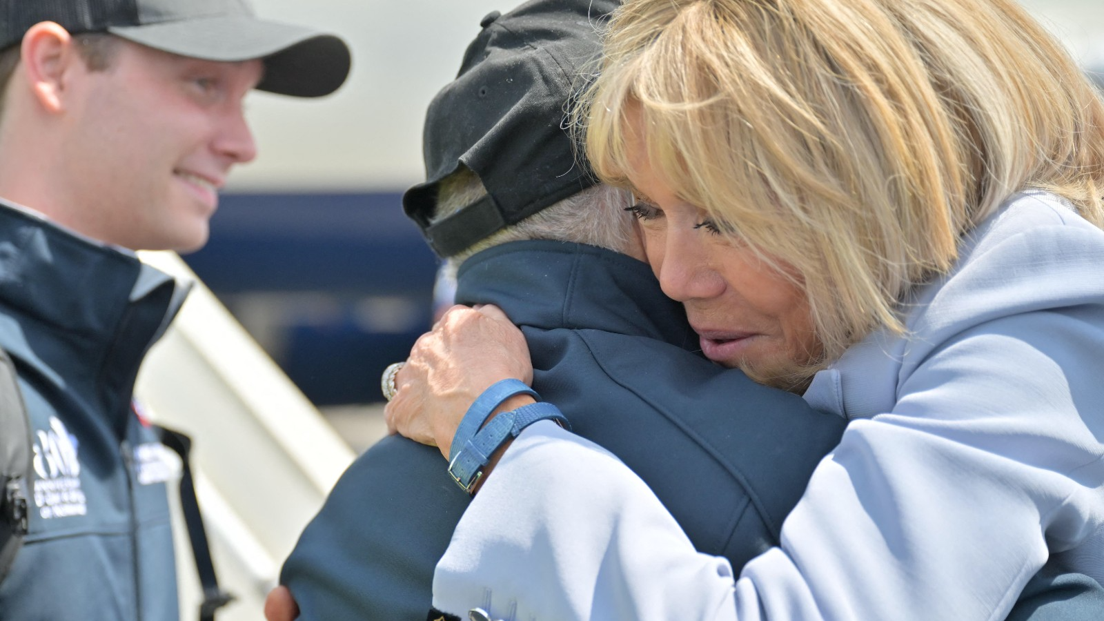Brigitte Macron welcomes veterans as they arrive at Deauville-Normandie Airport ahead of D-Day commemorations. /Lou Benoist/AFP
