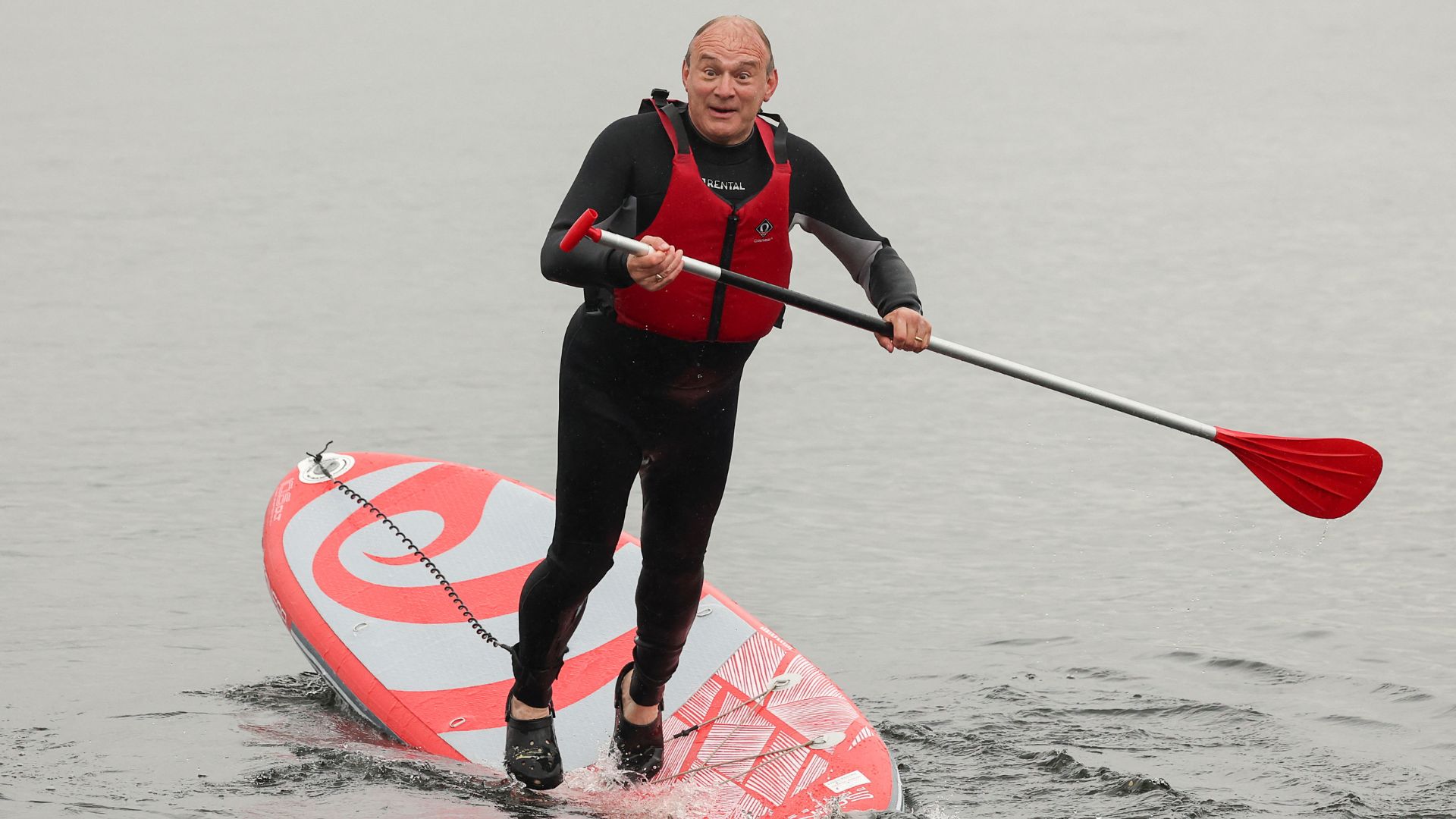 British leader of the Liberal Democrats party Ed Davey falls from a paddle board, at Lake Windermere. /Phil Noble/Reuters
