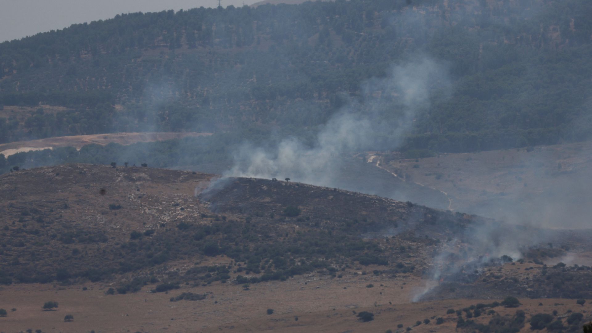 Smoke rises above northern Israel, after Hezbollah claimed it launched more than 200 rockets targeting Israeli military positions in northern Israel. /Ronen Zvulun/Reuters