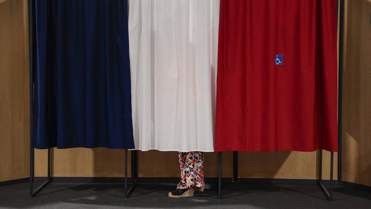 A voter at a polling station during the second round of French parliamentary elections. /Mohammed Badra/Pool/Reuters