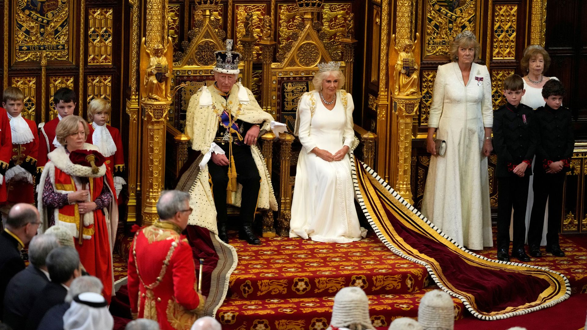 King Charles III and Queen Camilla sit on their thrones ahead of the king's speech at the State Opening of Parliament in London. /Kirsty Wigglesworth/Reuters