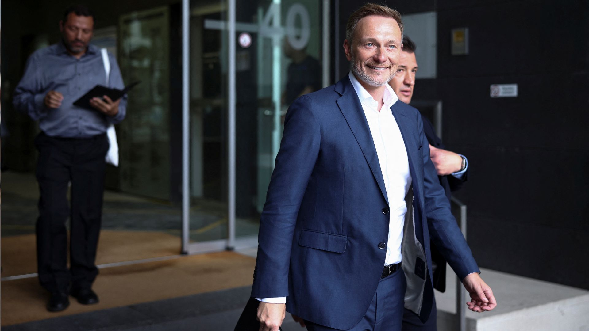 German Finance Minister Christian Lindner leaves his news conference on the 2025 draft budget. /Liesa Johannssen/Reuters