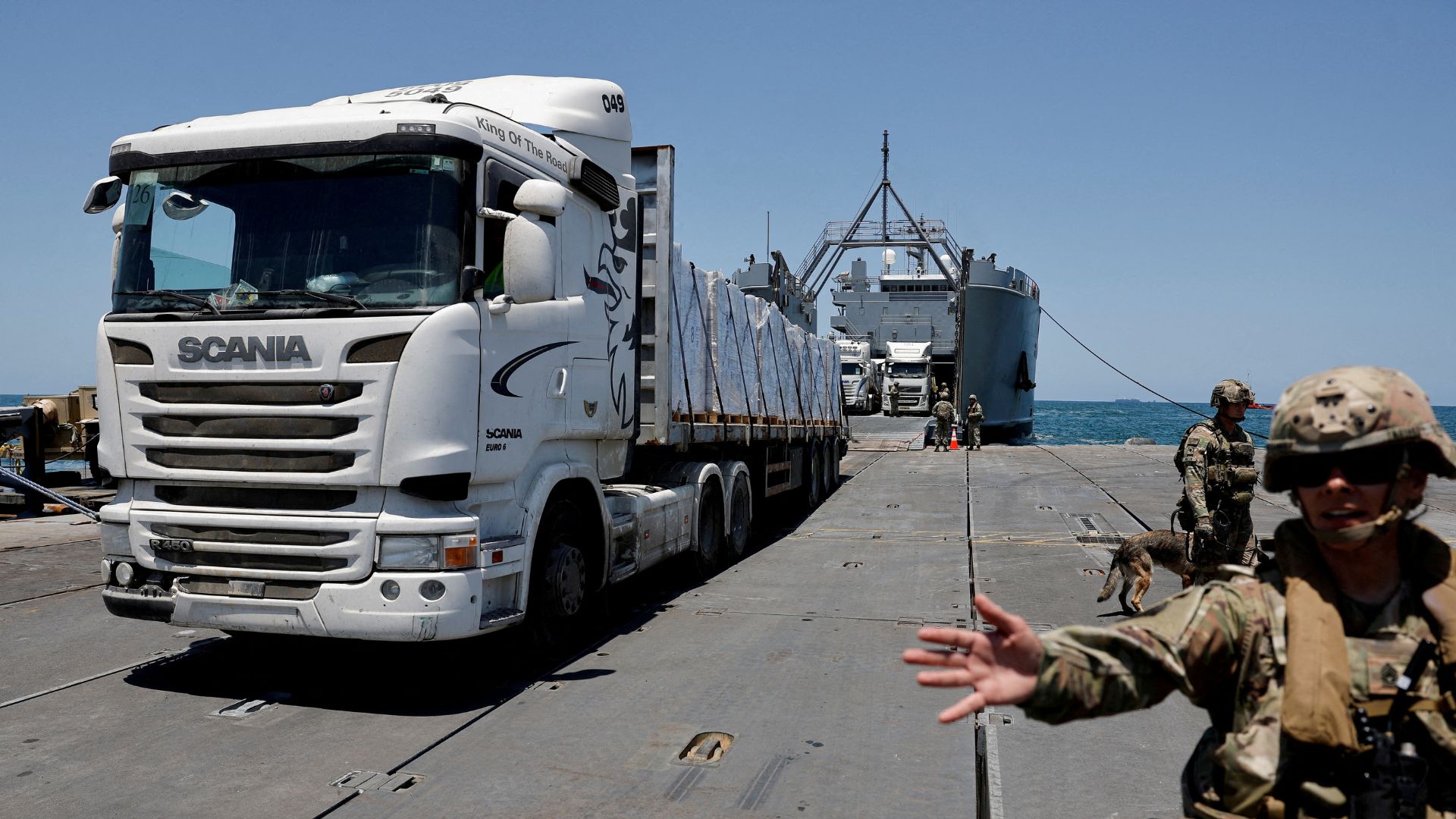 A truck carries humanitarian aid across Trident Pier. /Amir Cohen/Reuters 