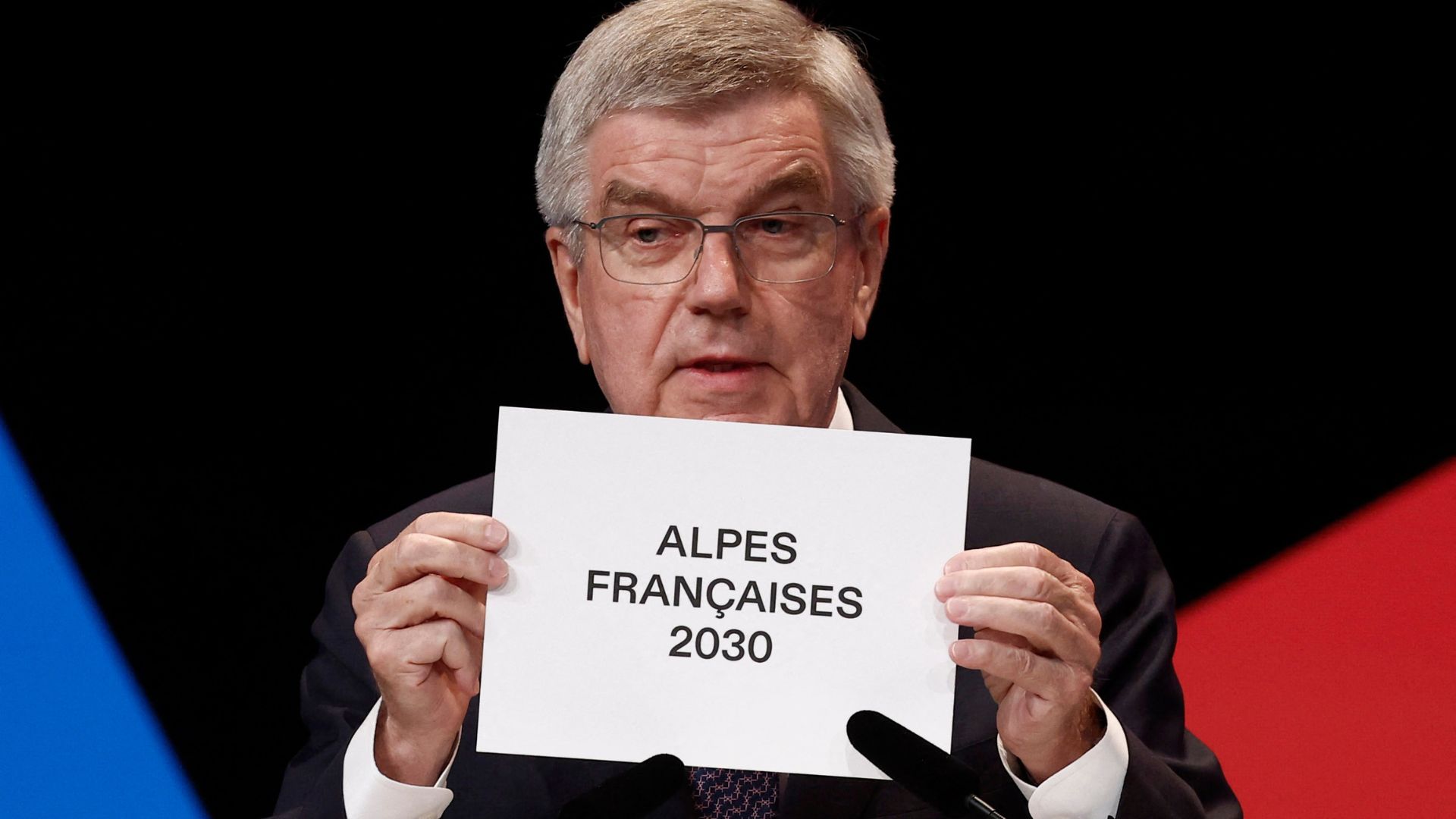 IOC President Thomas Bach announces the Alpes Francaises as the location for the Winter Olympics 2030 during the IOC Session. /Benoit Tessier/Reuters