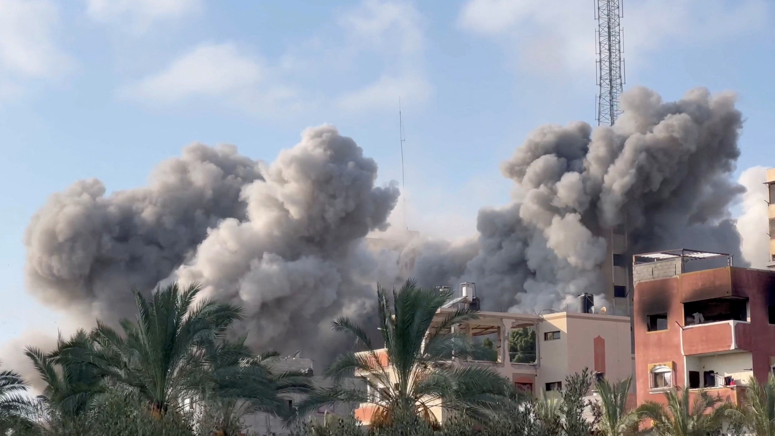 Smoke rises following an Israeli strike on a residential building in Gaza./ /Reuters