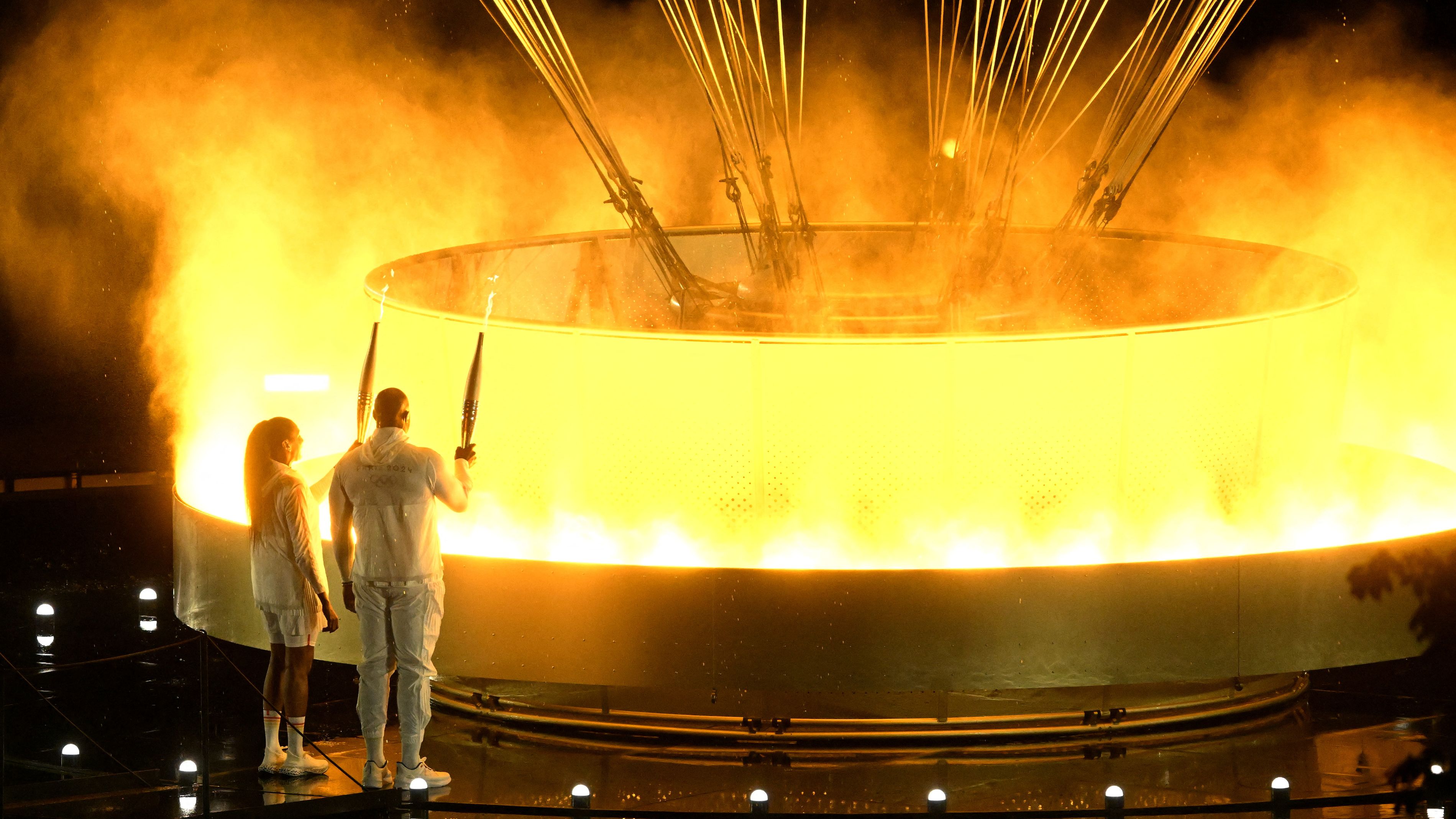 The Olympic cauldron was lit at the opening ceremony on Friday night. /Xia Yifang/Reuters