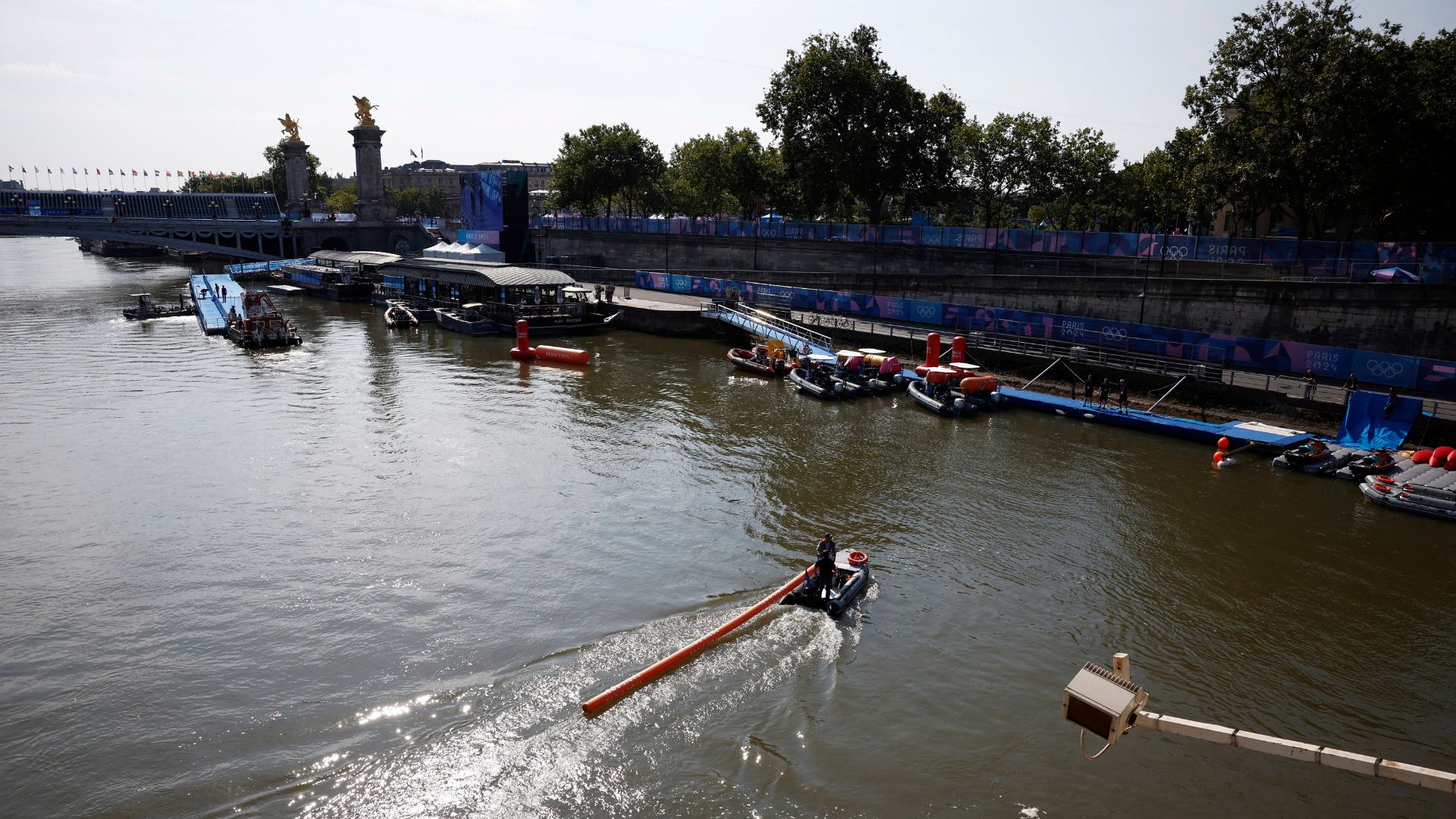 Workers remove a buoy after triathlon training was canceled. /Benoit Tessier/Reuters